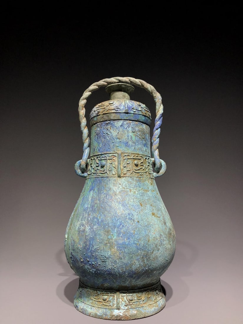 A Bronze Handle Vessel: A Bronze Handle Vessel. Dimensions: 6.69in x 6.30in x 14.17in; Weight: 6lbs.