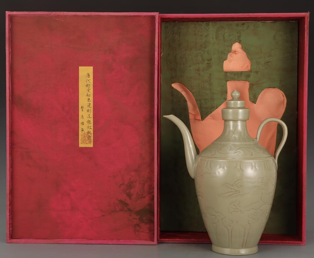 A Yue Ware Celadon Carved Ewer: A Yue Ware Celadon Carved Ewer. Height: 12.99in Diameter: 10.24in.