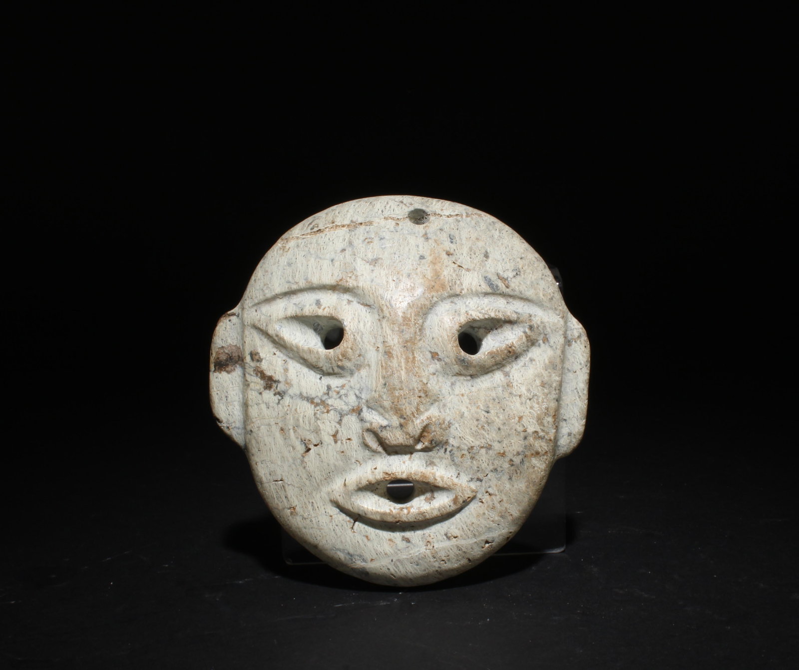 A Carved Jadestone Face Mask (1 of 3)