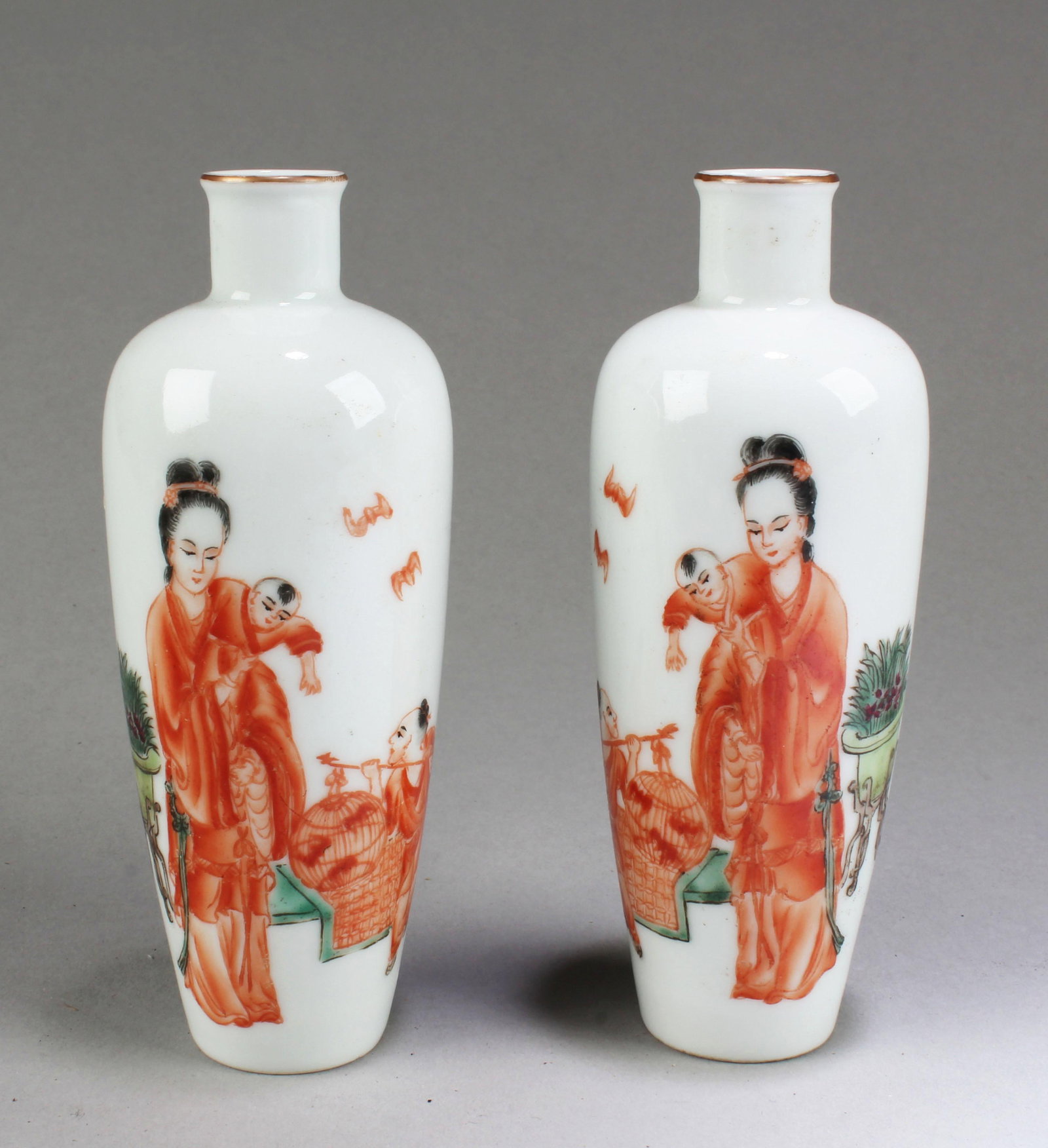 A Pair of Chinese Porcelain Vases: A Pair of Chinese Porcelain Vases, decorated with a woman and two young children. 'YongZheng' mark at base. Height: 5"