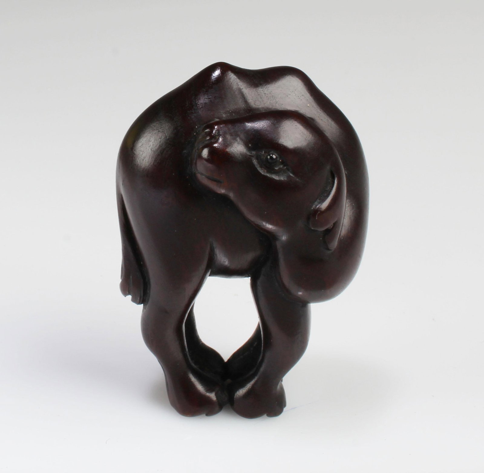 A Carved Wooden Animal Figurine: A Carved Wooden Animal Figurine. Height: 2"
