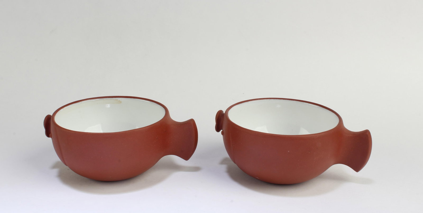 A Pair of Zisha Cups: A Pair of Zisha Cups. Length: 3.6" Height: 1.5"
