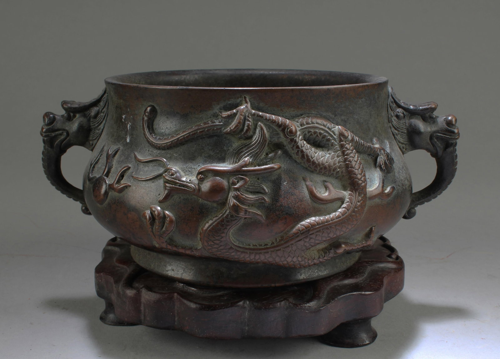 BRONZE CAST 'DRAGONS' CENSER WITH WOODEN STAND (1 of 3)