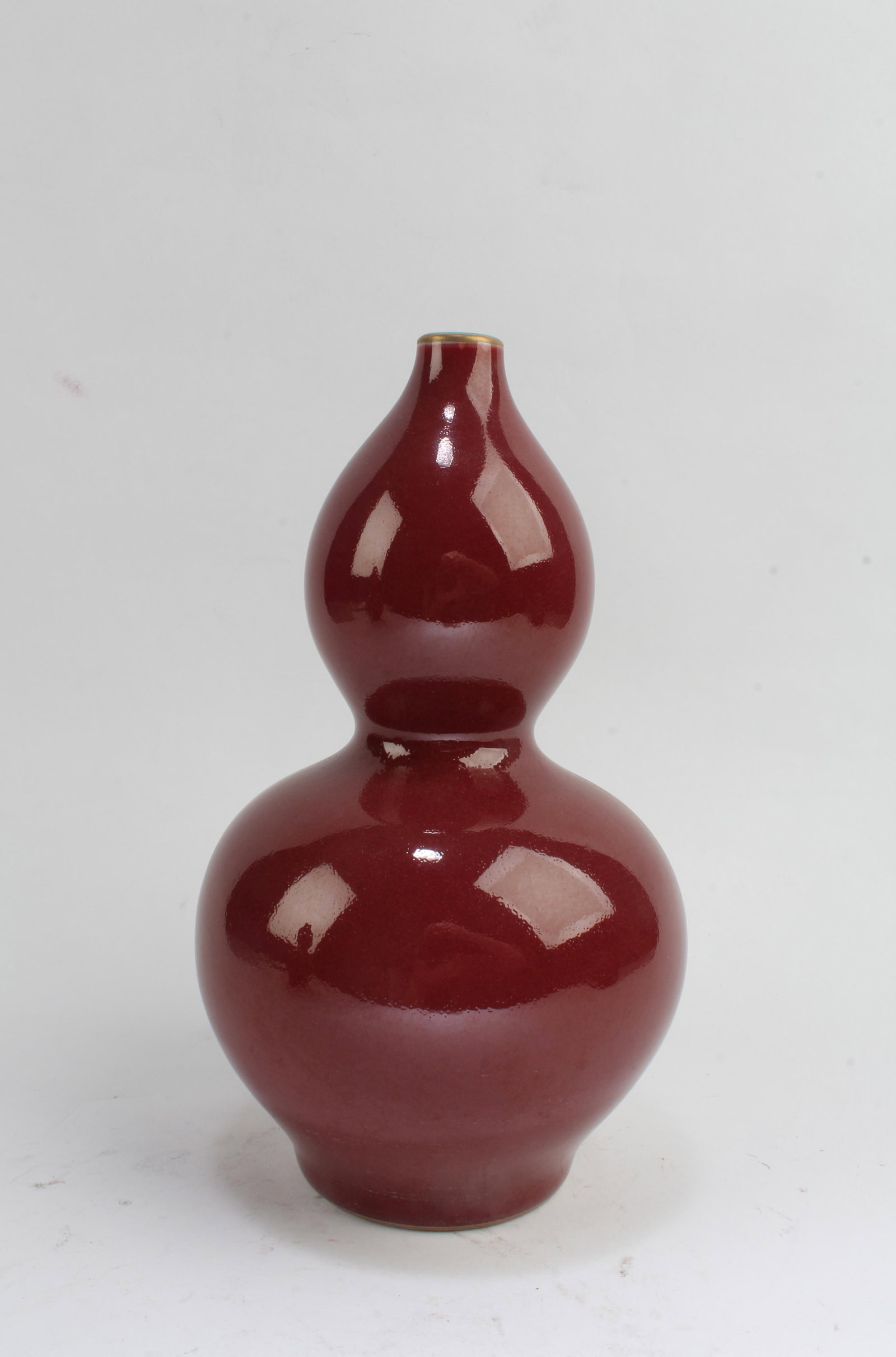Chinese Porcelain Double Gourd Vase: Chinese Porcelain Double Gourd Vase. 'QianLong' mark at base. Height: 7.5"