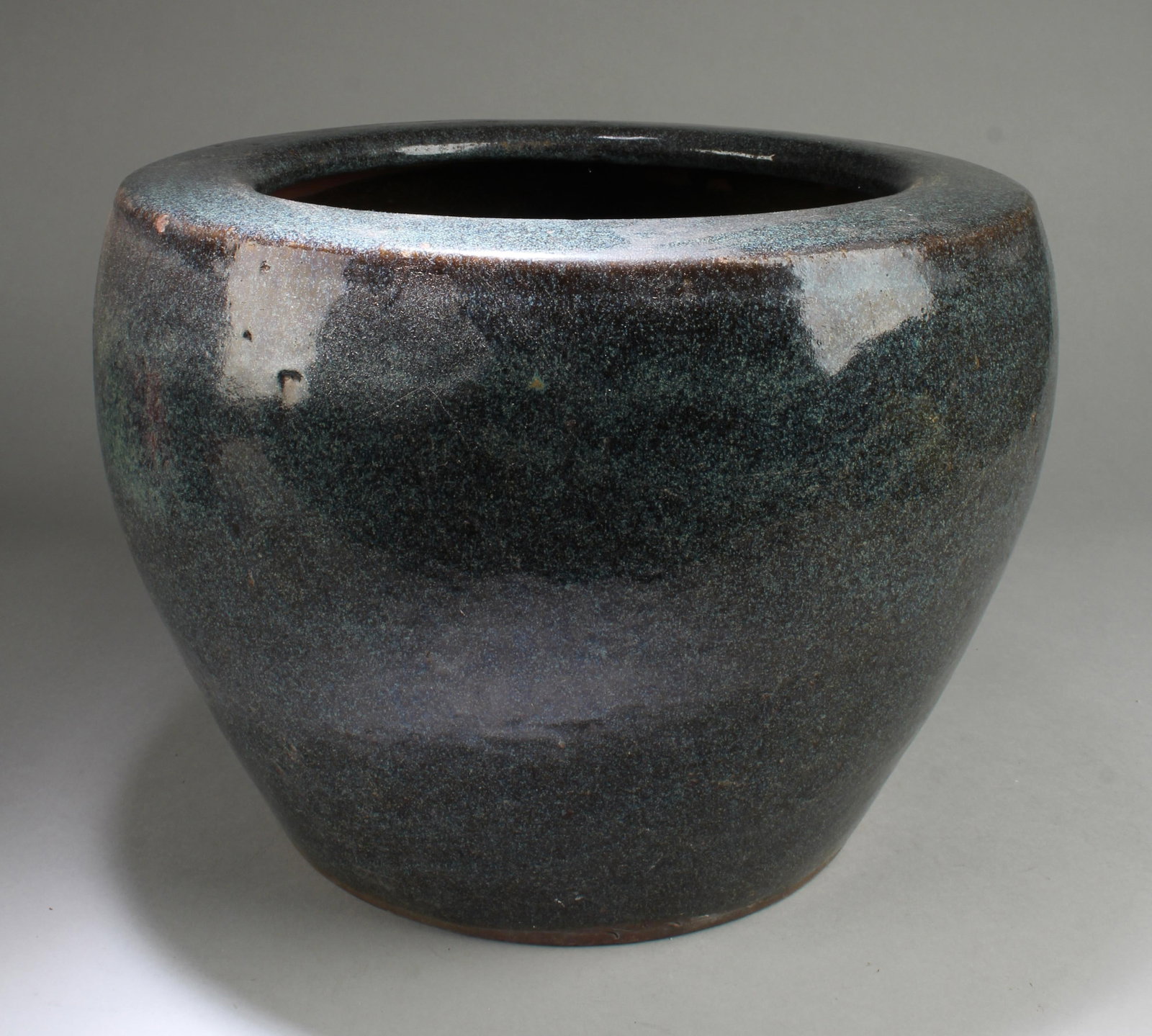 A Porcelain Tank: A Porcelain Tank. Height: 10.5"