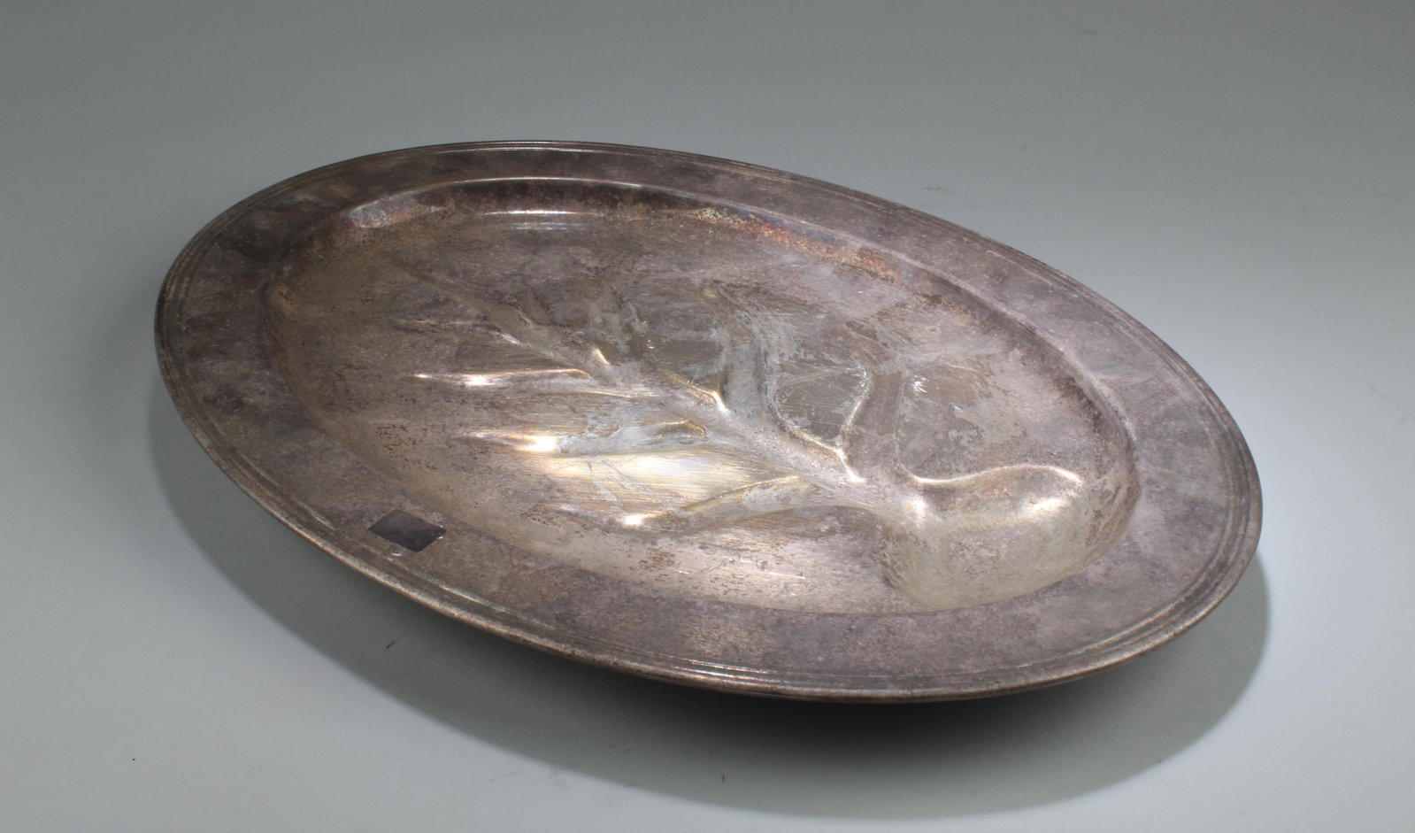 A Silver-Plated Oblong Shaped Tray: A Silver-Plated Oblong Shaped Tray. Length: 18"
