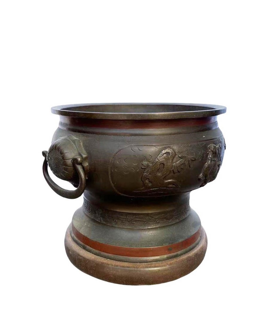 A Round Shaped Bronze Incense Burner: A Round Shaped Bronze Incense Burner. Comes fitted with a wooden stand. Height: 10.5" Diameter: 14.5"