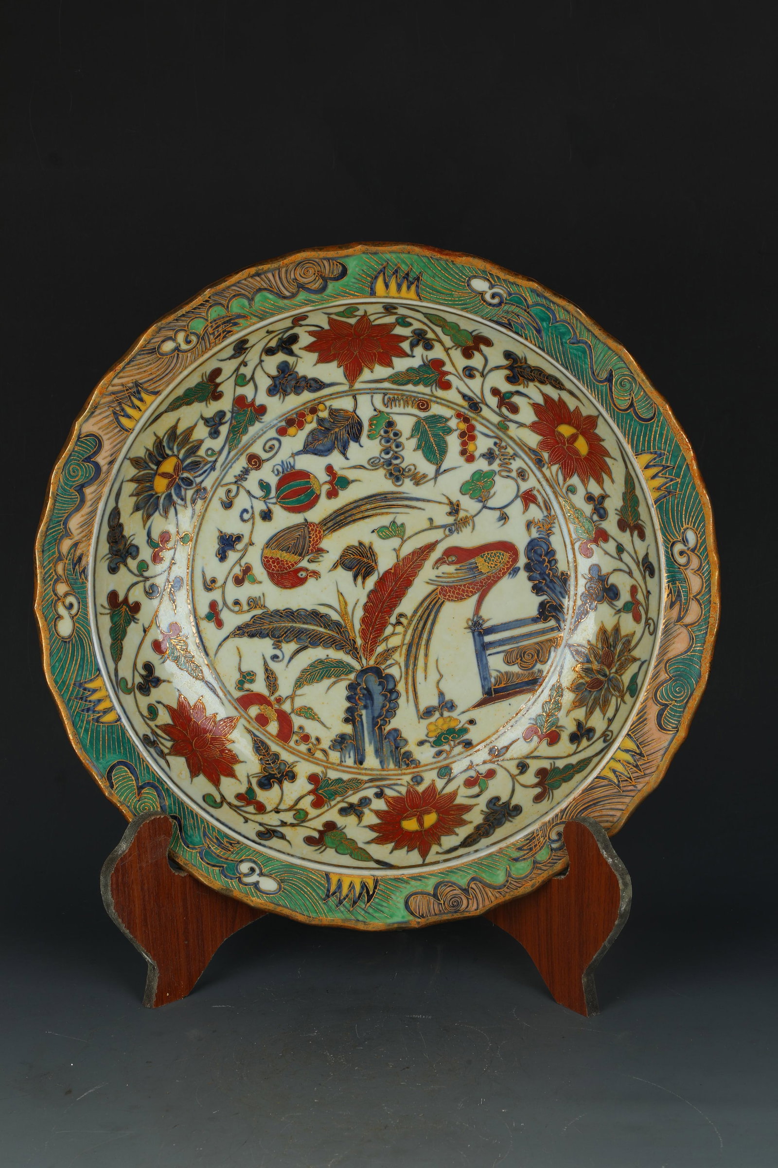 A Porcelain Charger: A Porcelain Charger. Eight character mark at base. Diameter: 15.5"