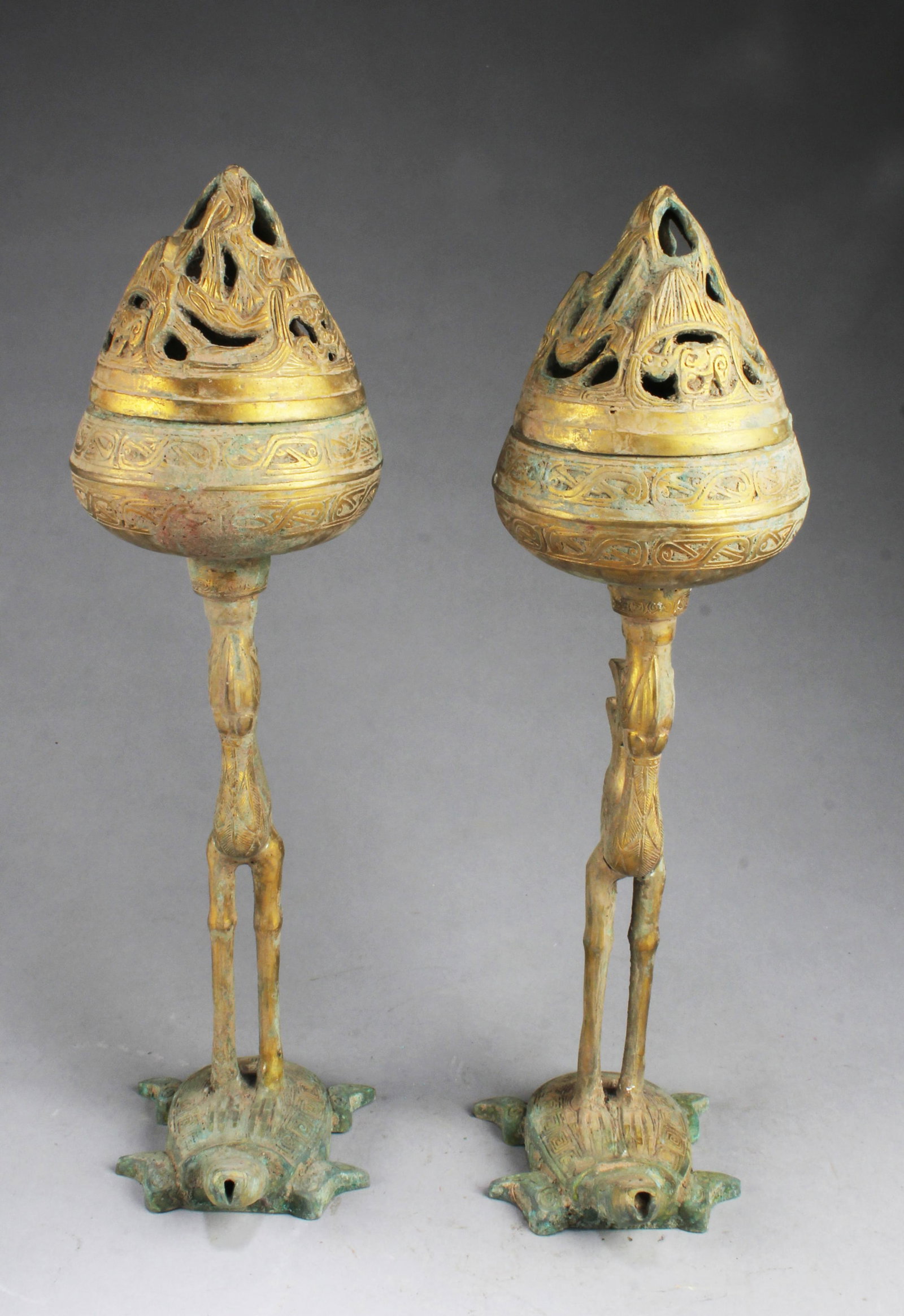A Pair of Bronze Holders: A Pair of Bronze Holders. Height: 19.5"