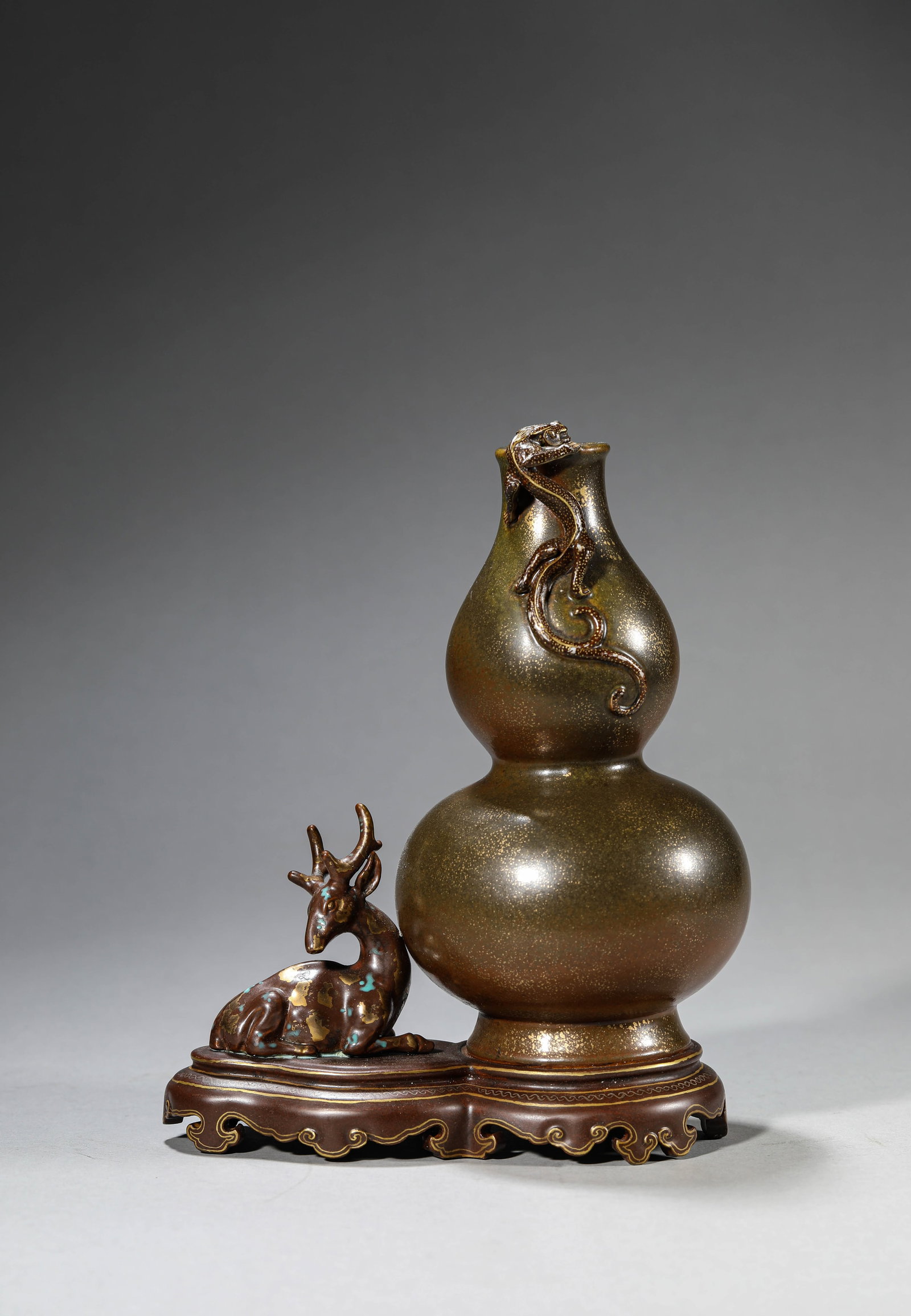 A 'Bronze-Glaze Imitation' 'Double-Gourd' Vase: A 'Bronze-Glaze Imitation' 'Double-Gourd' Vase. Dimensions: Length: 6.97" x Width: 3.82" x Height: 7.56". All measurements are approximate.