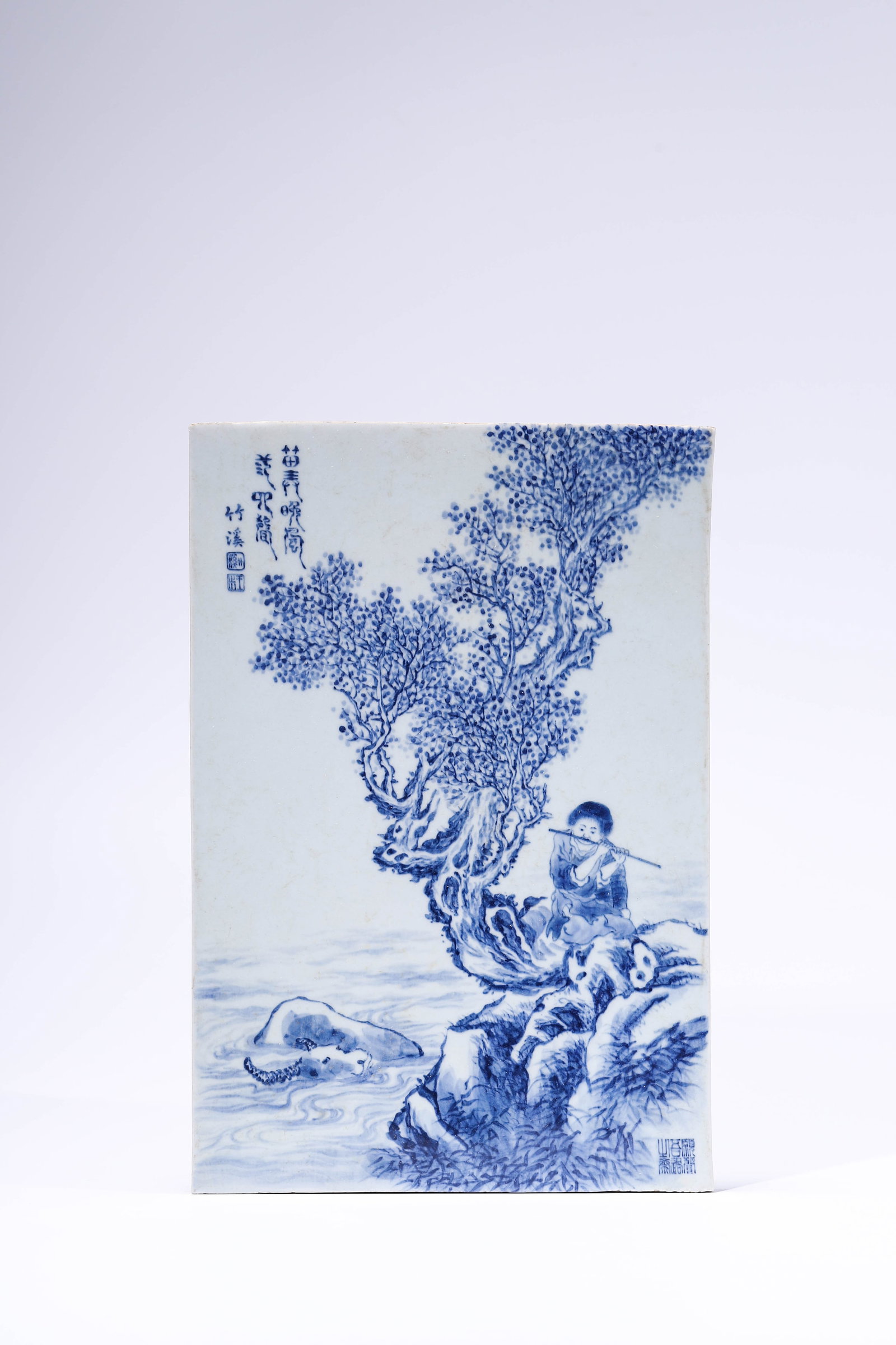 A Blue and White 'Cowherd and Poem' Plaque: A Blue and White 'Cowherd and Poem' Plaque. Dimensions: Length: 14.37" x Width: 9.69" x Height: 0.31". All measurements are approximate.