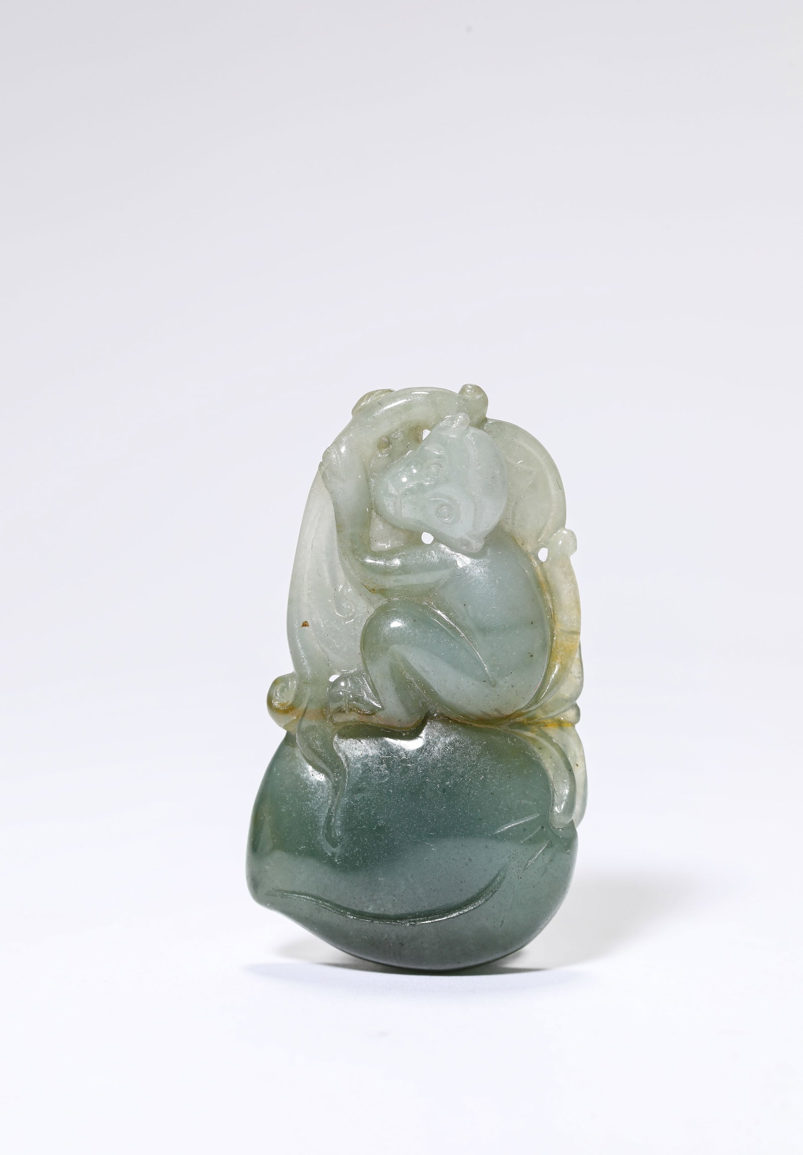A Jadeite 'Carved Monkey Offering Longevity' (1 of 4)