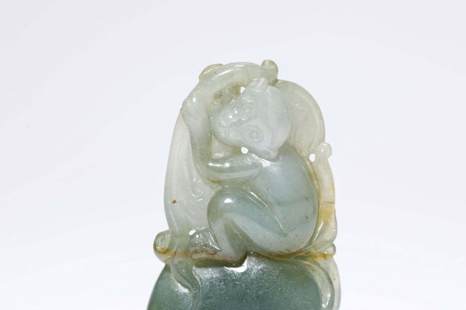 A Jadeite 'Carved Monkey Offering Longevity' - 2