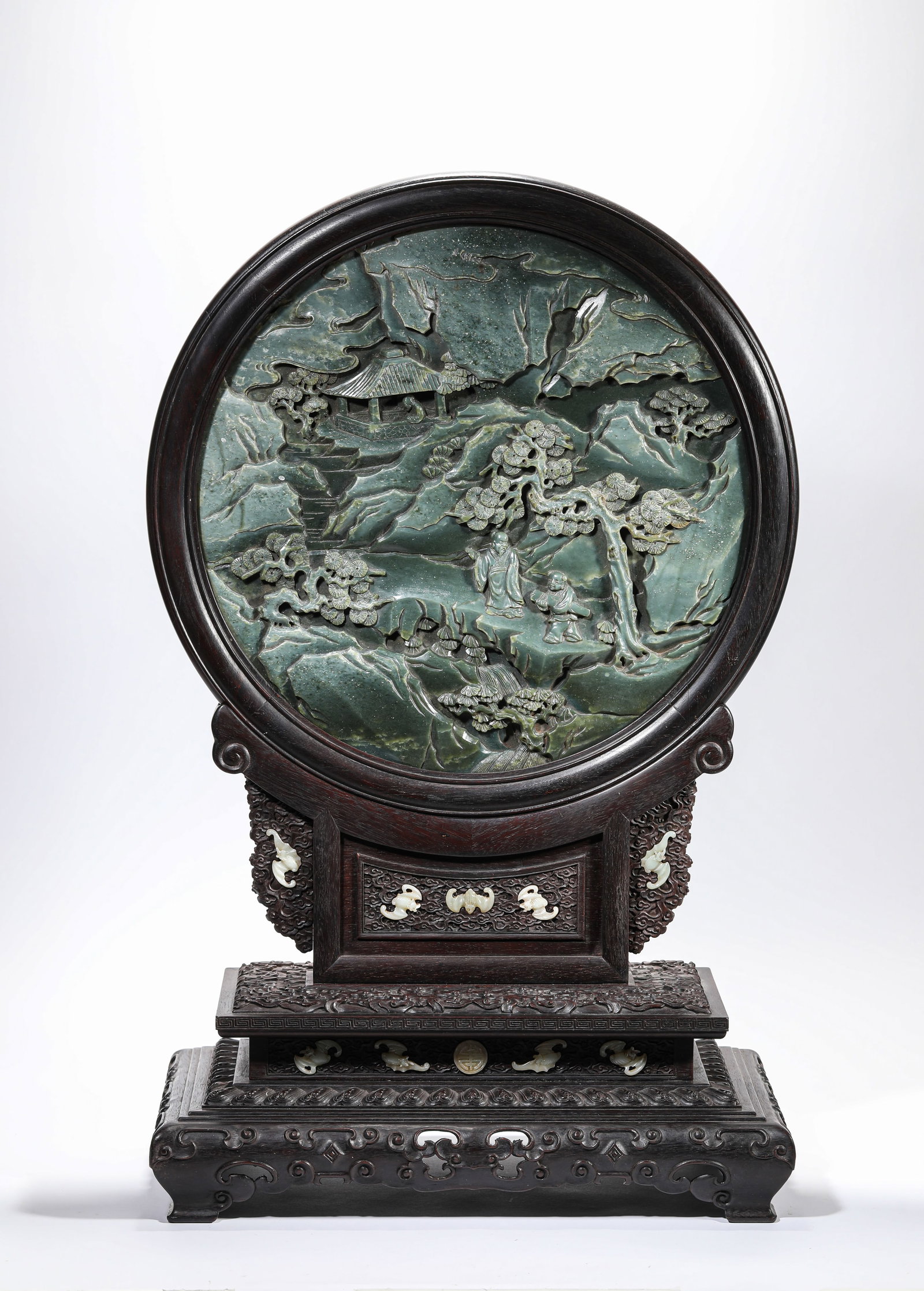 A Spinach Jade 'Carved Scholars Under a Pine Tree' Table Screen: A Spinach Jade 'Carved Scholars Under a Pine Tree' Table Screen. Dimensions: Length: 15.75" x Width: 9.06" x Height: 25.39". All measurements are approximate.