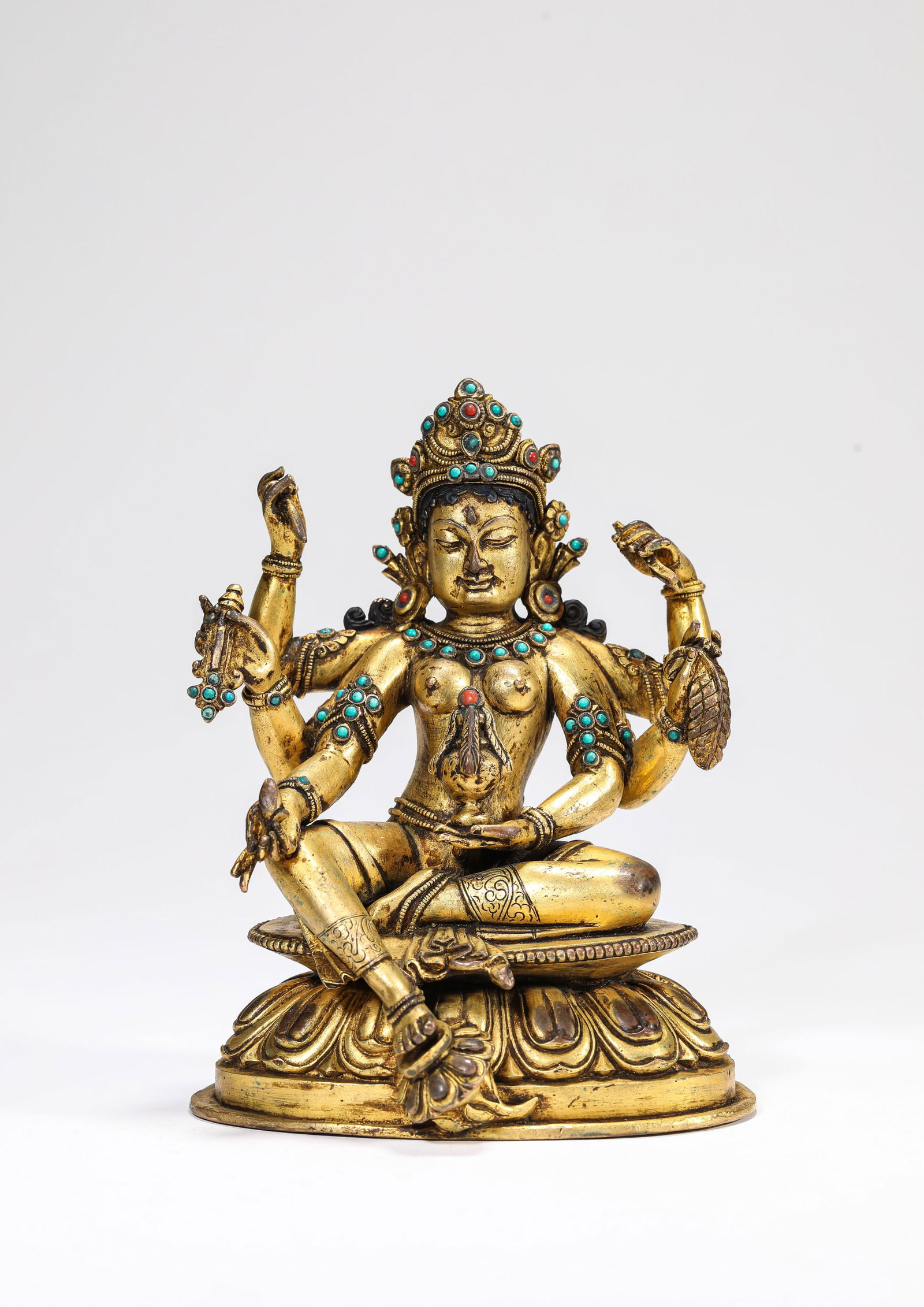 A Gilt-Bronze Figure of Six-Armed Buddha: A Gilt-Bronze Figure of Six-Armed Buddha. Dimensions: Weight: 1289 g. Length: 4.49" x Width: 3.54" x Height: 5.83". All measurements are approximate.