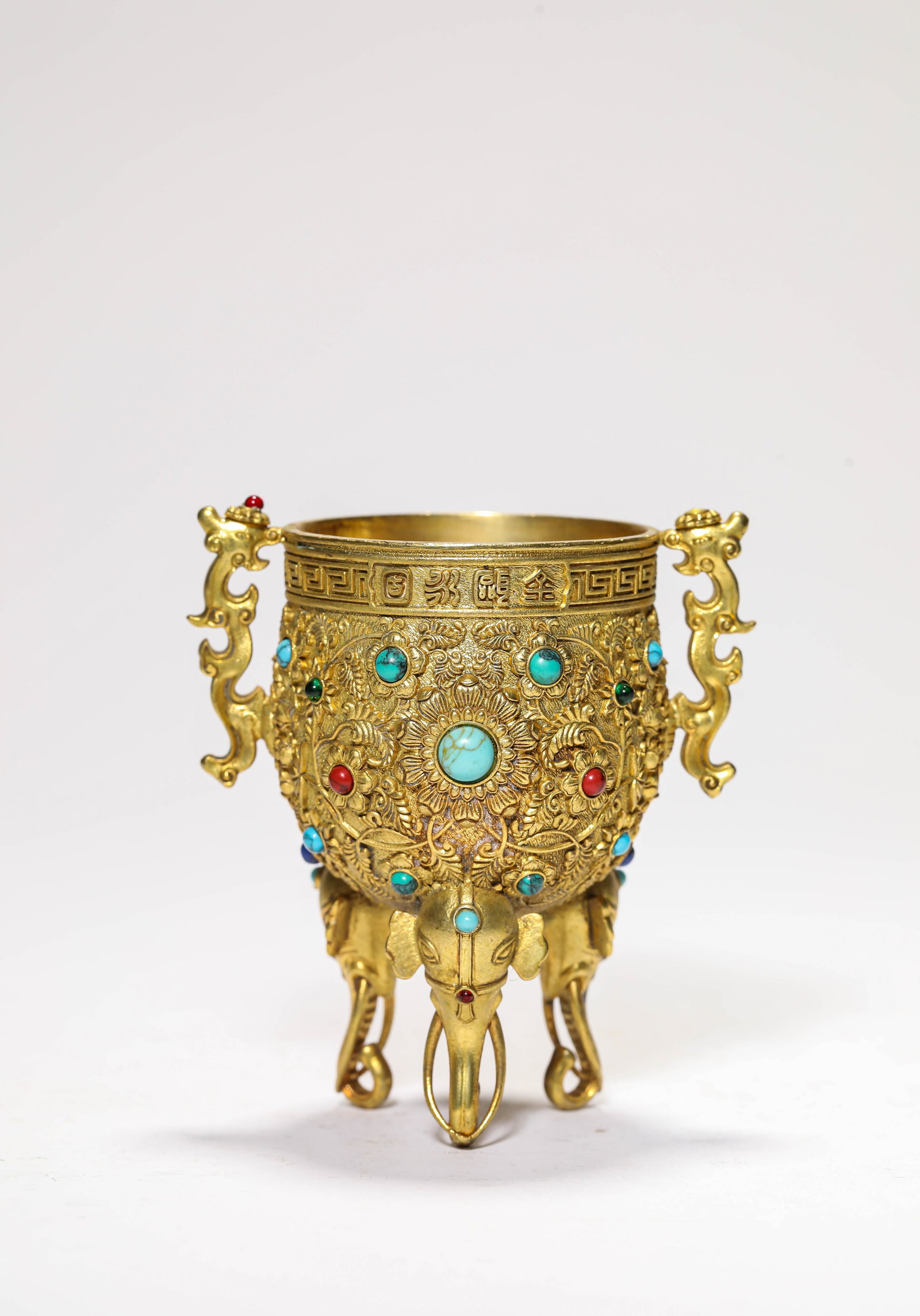 A Gilt-Bronze and Gem-Set Cup: A Gilt-Bronze and Gem-Set Cup. Dimensions: Weight: 265 g. Length: 3.35" x Width: 2.56" x Height: 3.66". All measurements are approximate.