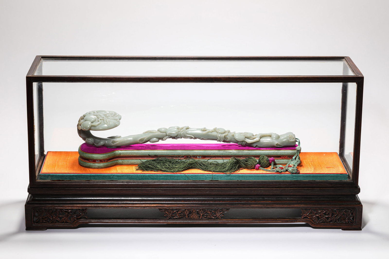 A Jade 'Carved Peach' Ruyi Sceptre: A Jade 'Carved Peach' Ruyi Sceptre. Dimensions: Length: 14.41" x Width: 3.39" x Height: 2.20". All measurements are approximate.