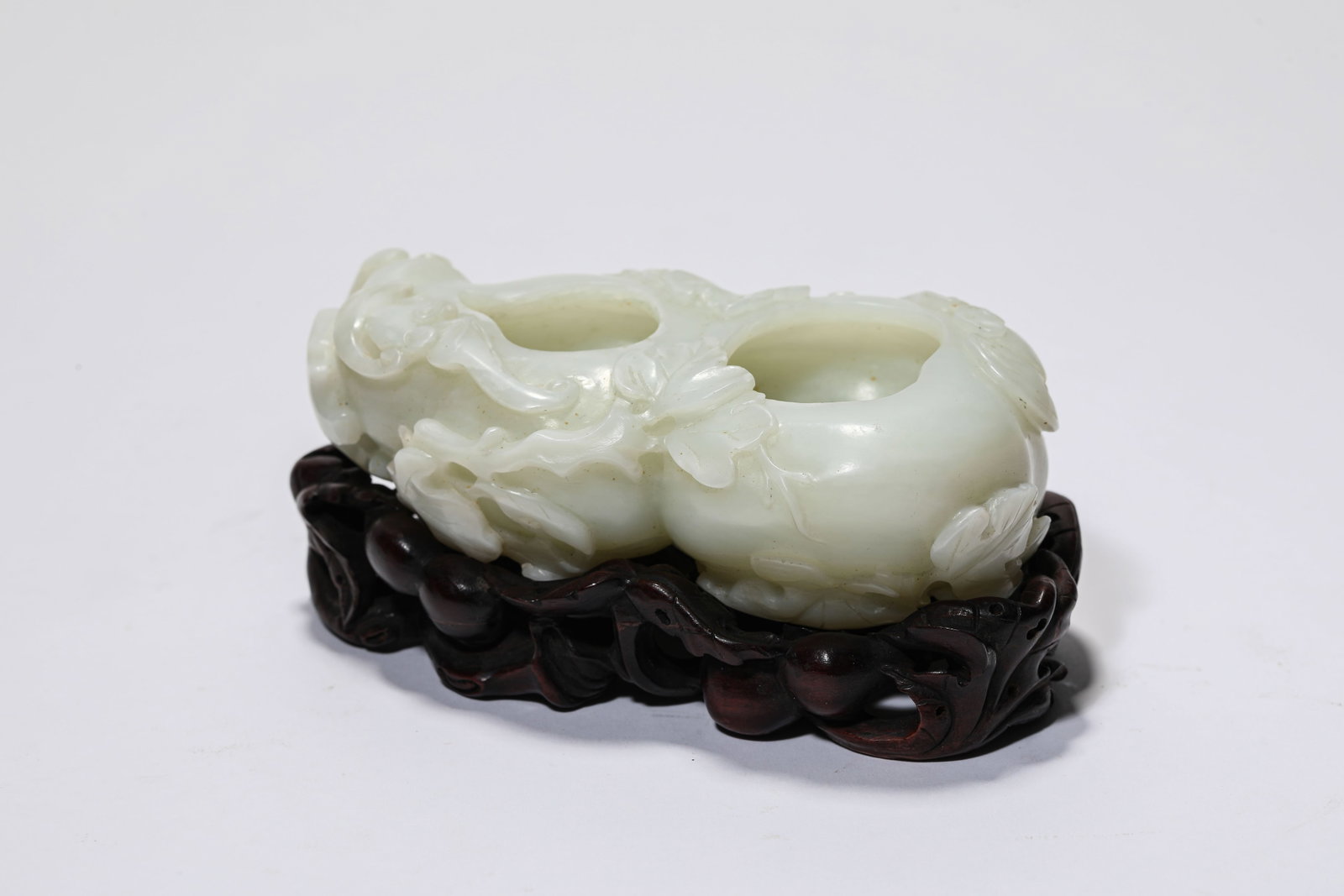 A Jade 'Carved Bat and Deer' Water Pot: A Jade 'Carved Bat and Deer' Water Pot. Dimensions: Length: 4.53" x Width: 2.60" x Height: 1.42". All measurements are approximate.