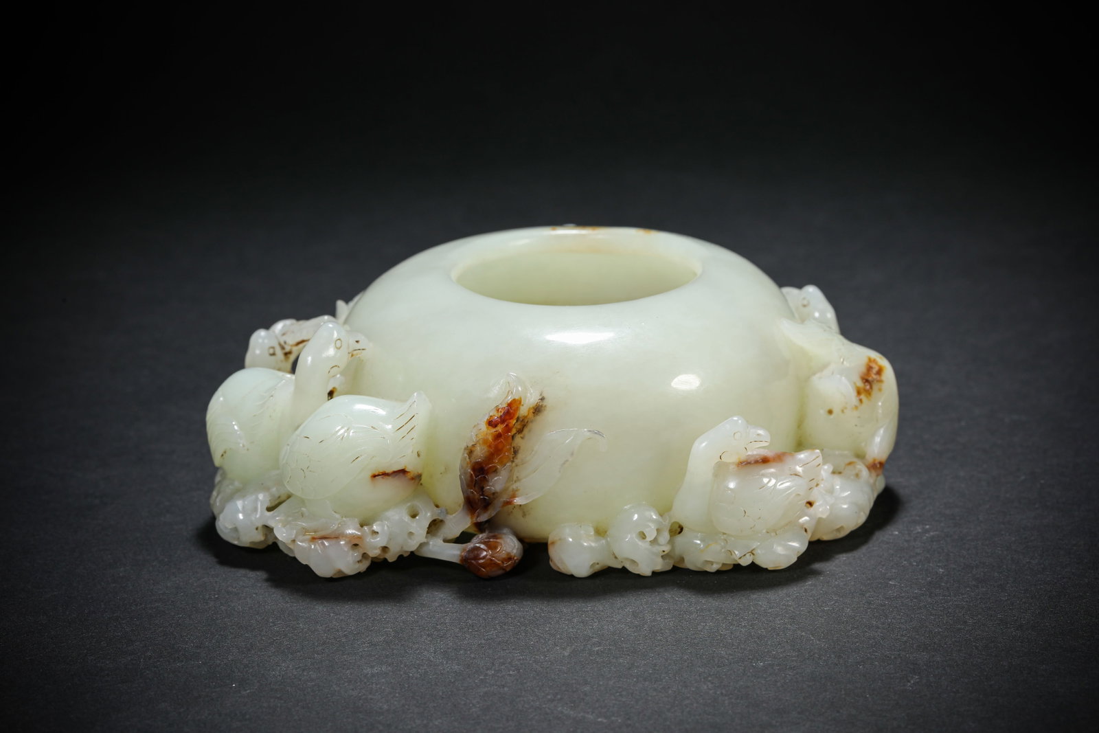 A Jade Water Pot: A Jade Water Pot. Dimensions: Length: 4.92" x Width: 4.02" x Height: 1.69". All measurements are approximate.