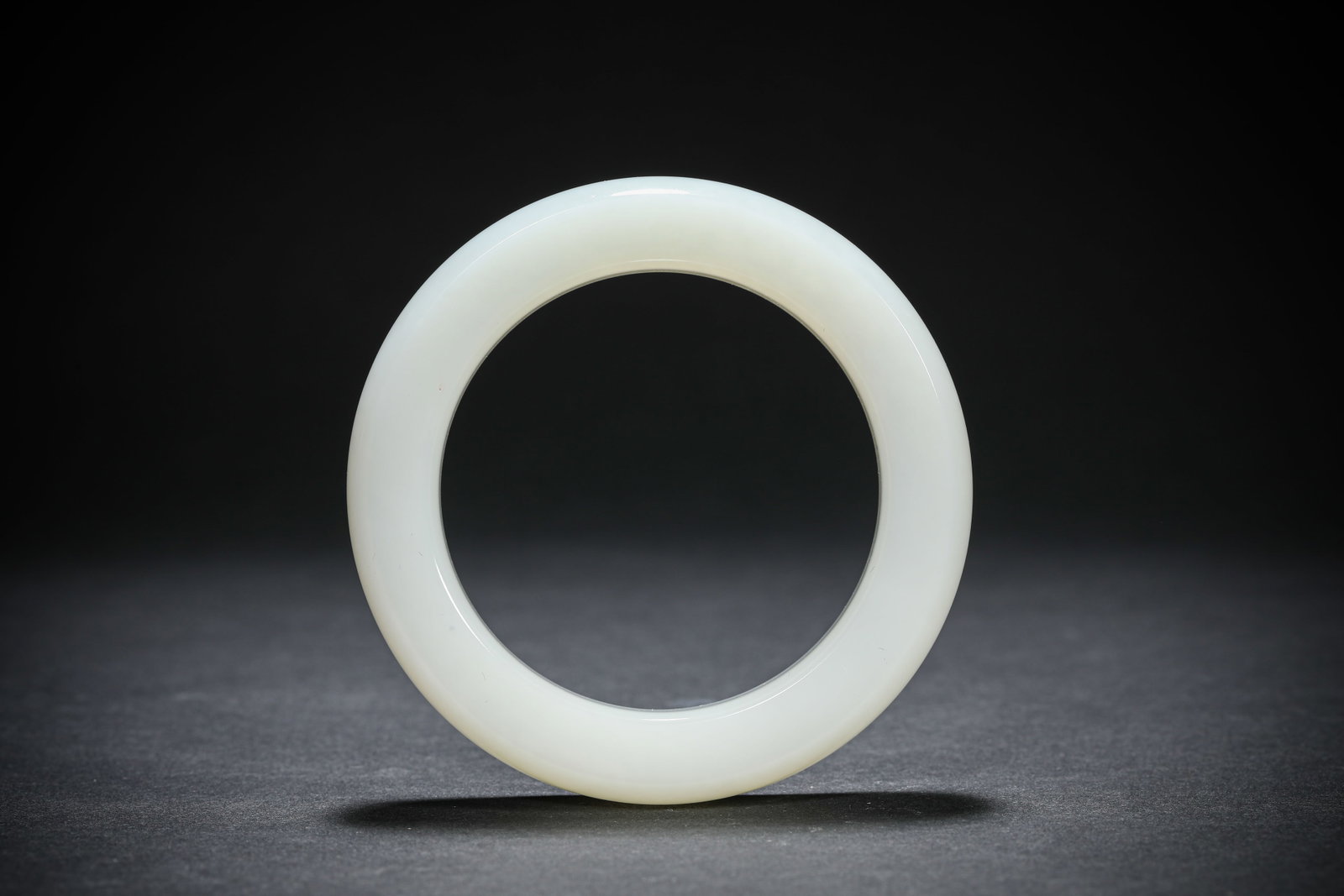 A Jade Bangle: A Jade Bangle. Dimensions: Width: 2.28". All measurements are approximate.
