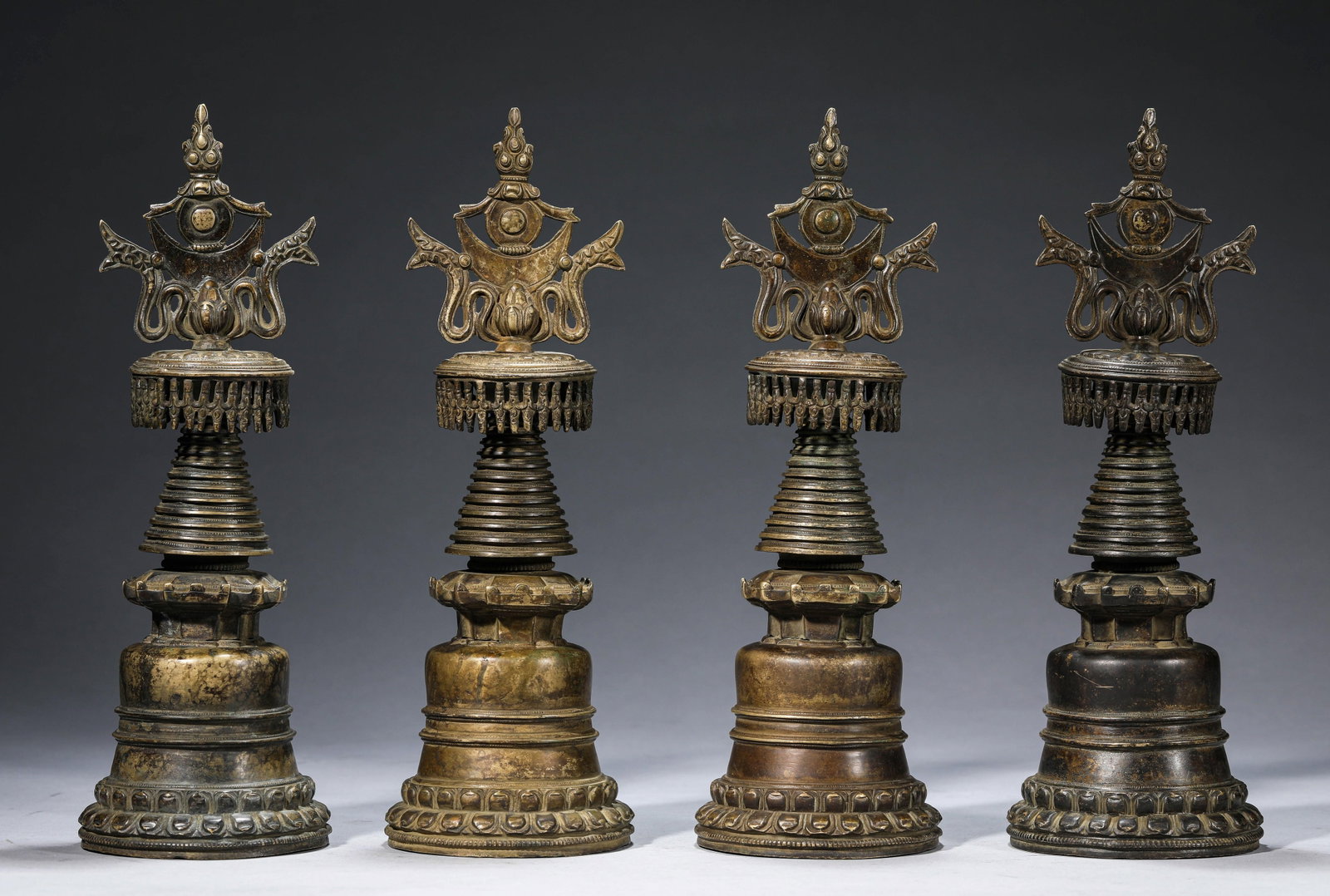 A Group of 'Tibetan Kadam-Style' Alloy Bronze Stupas: A Group of 'Tibetan Kadam-Style' Alloy Bronze Stupas. Dimensions: Weight: 5100 g. Width: 4.13" x Height: 11.93". All measurements are approximate.