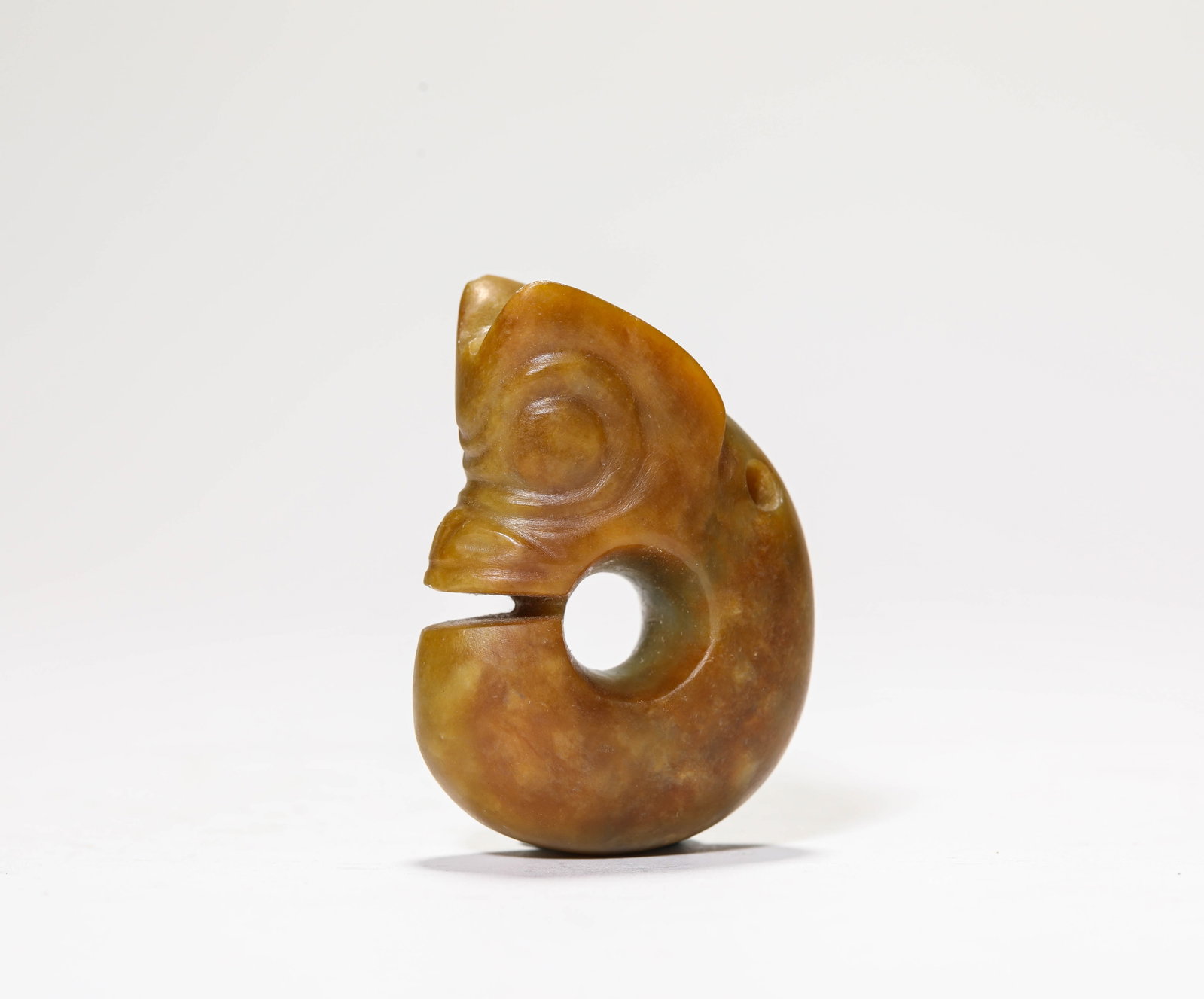 A Jade 'Pig-Dragon': A Jade 'Pig-Dragon'. Dimensions: Length: 1.61" x Width: 0.75" x Height: 2.24". All measurements are approximate.