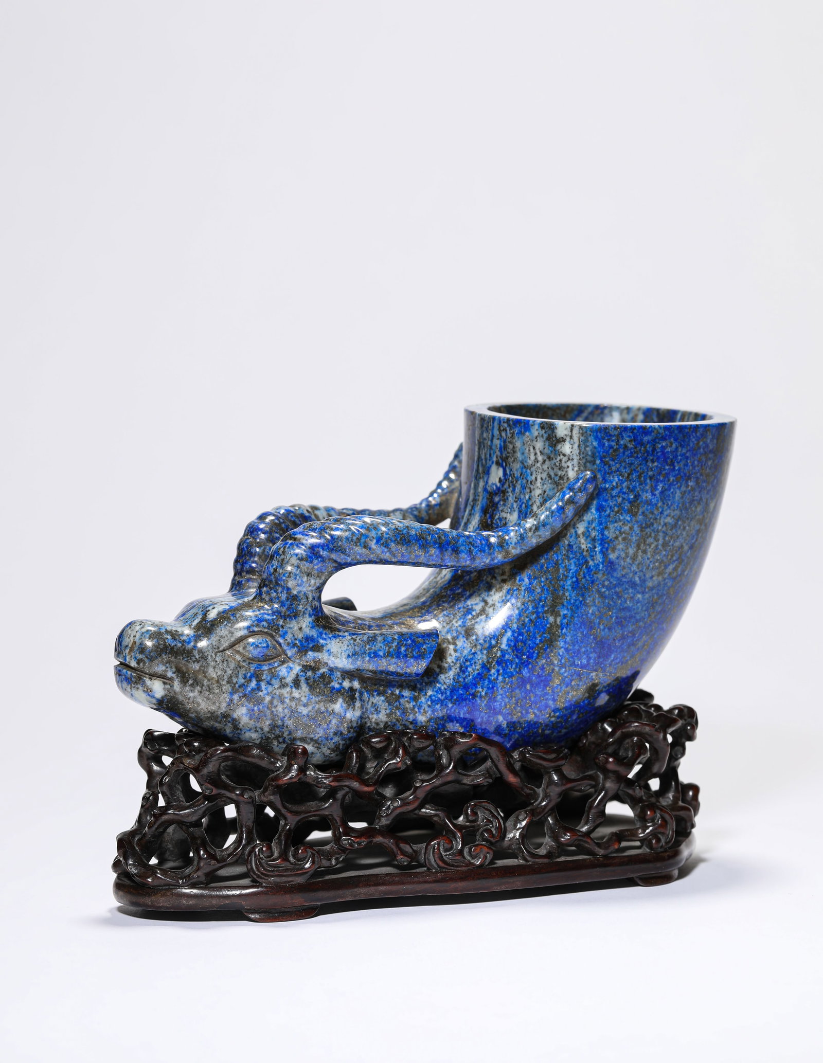 A Lapis Lazuli 'Ox-Head' Cup: A Lapis Lazuli 'Ox-Head' Cup. Dimensions: Length: 7.09" x Width: 3.15" x Height: 4.45". All measurements are approximate.
