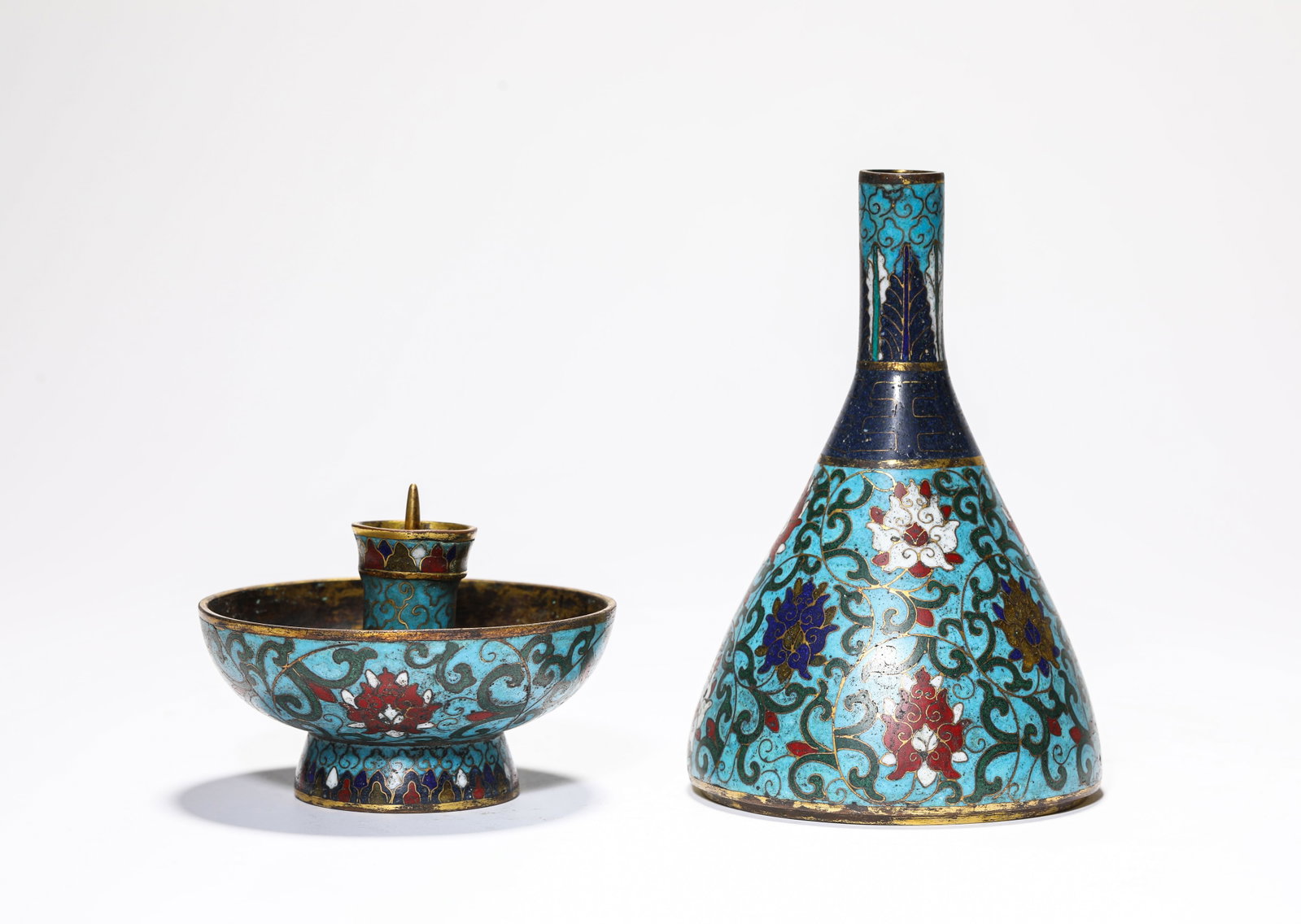 A Cloisonne Enamel 'Interlocking Lotus' Candleholder: A Cloisonne Enamel 'Interlocking Lotus' Candleholder. Dimensions: Weight: 700 g. Width: 4.06" x Height: 7.80". All measurements are approximate.