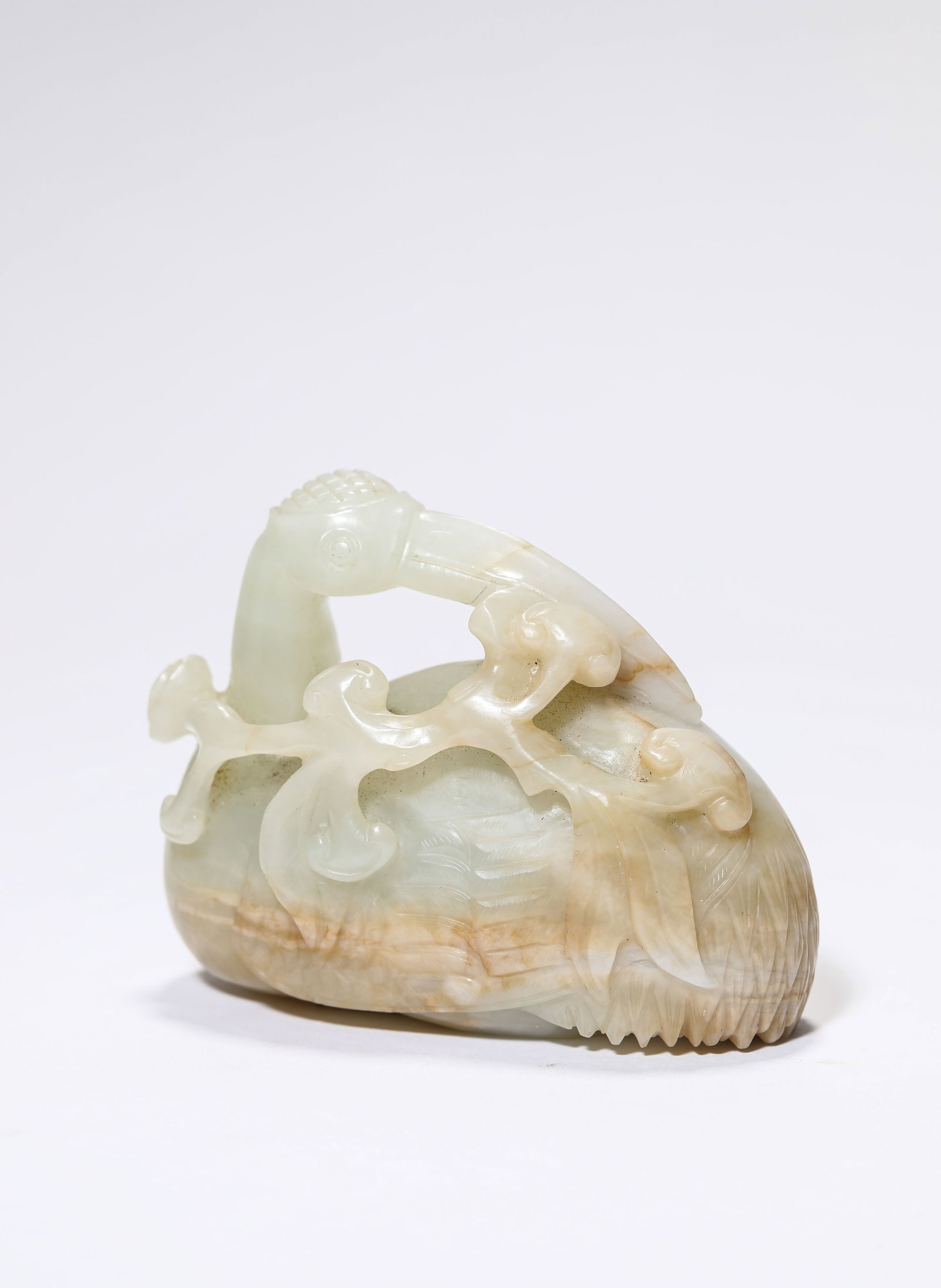 A Jade 'Carved Goose Holding a Lingzhi' Ornament: A Jade 'Carved Goose Holding a Lingzhi' Ornament. Dimensions: Length: 2.83" x Width: 1.42" x Height: 2.17". All measurements are approximate.