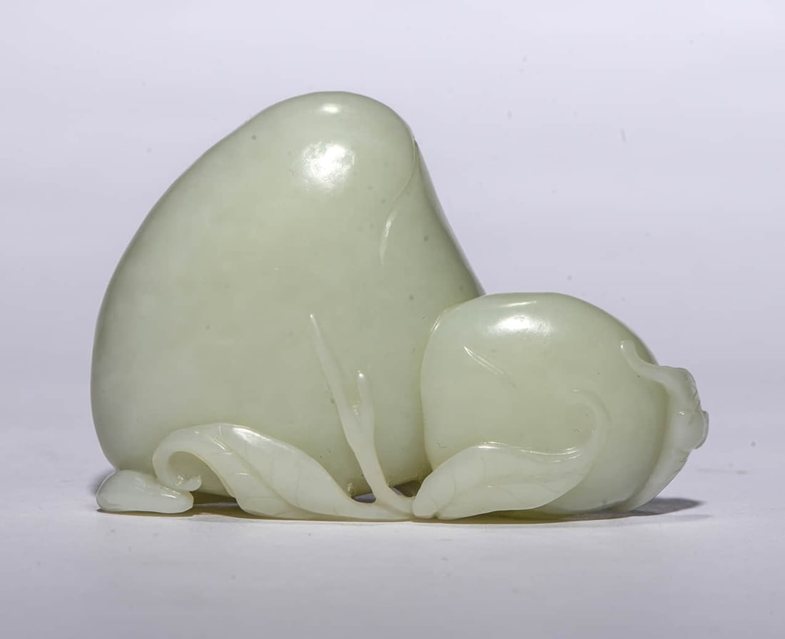 A White Jade 'Peach of Longevity' Ornament: A White Jade 'Peach of Longevity' Ornament. Dimensions: Width: 3.35" x Height: 2.44". All measurements are approximate.