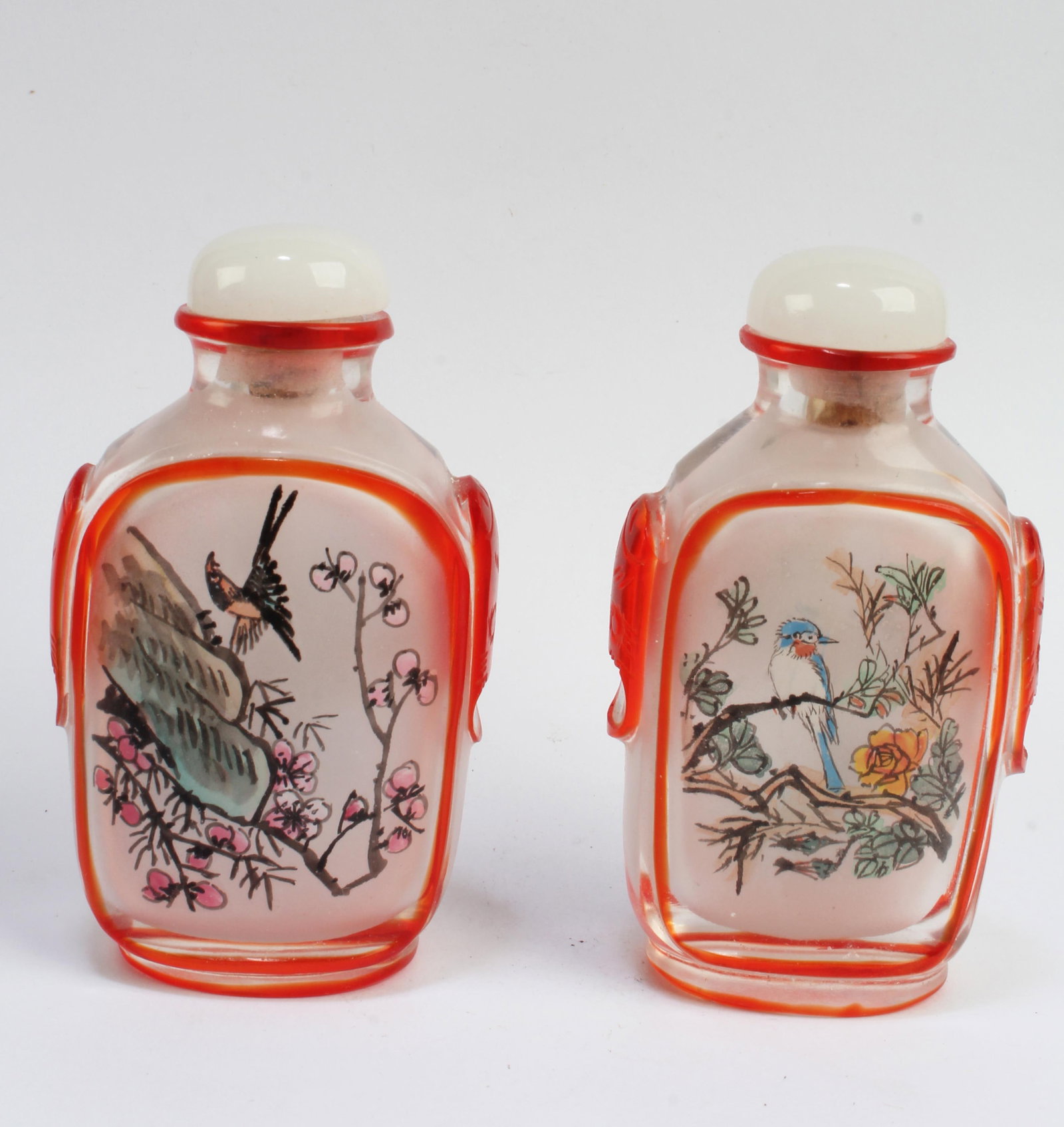 A Pair of Peking Glass Snuff Bottles: A Pair of Peking Glass Snuff Bottles. Height: 2.75"