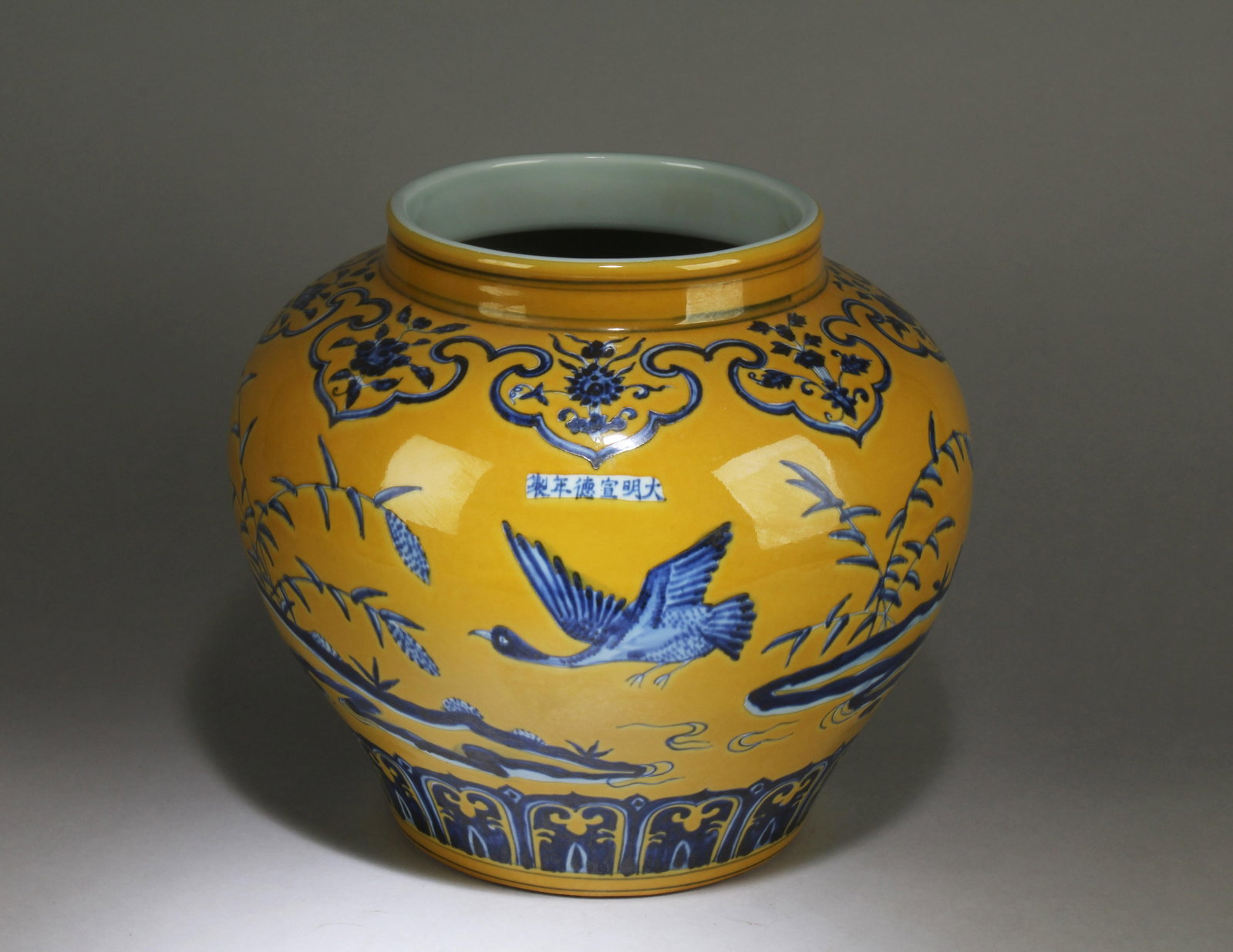 A Blue and White Yellow Background Chinese Pot: A Blue and White Yellow Background Chinese Pot. Dimension: 11.75" x 12.5".
