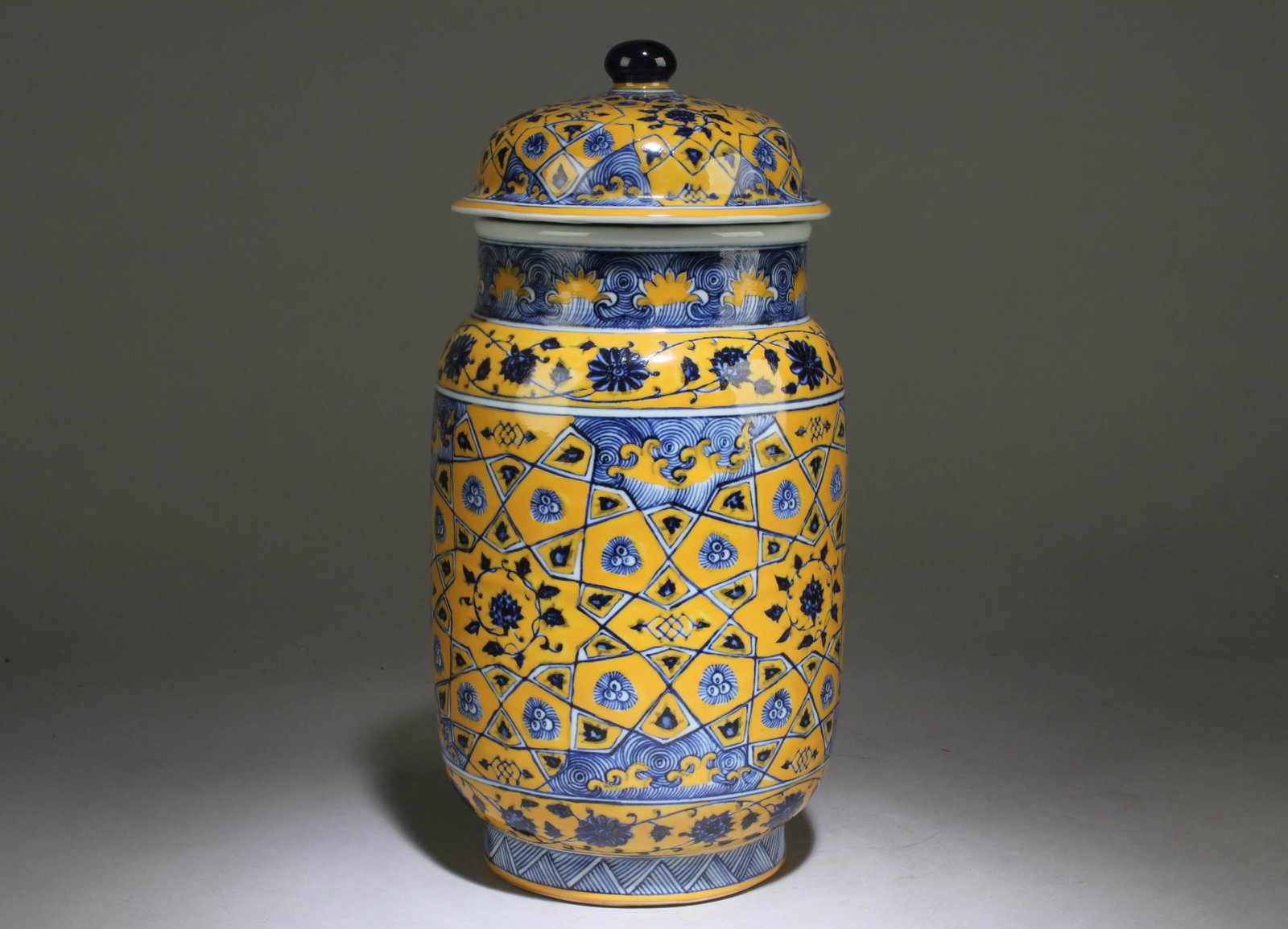 A Chinese Blue and White Container with Lid: A Chinese Blue and White Yellow Background Container with Lid. Dimension: 12" x 5.5".