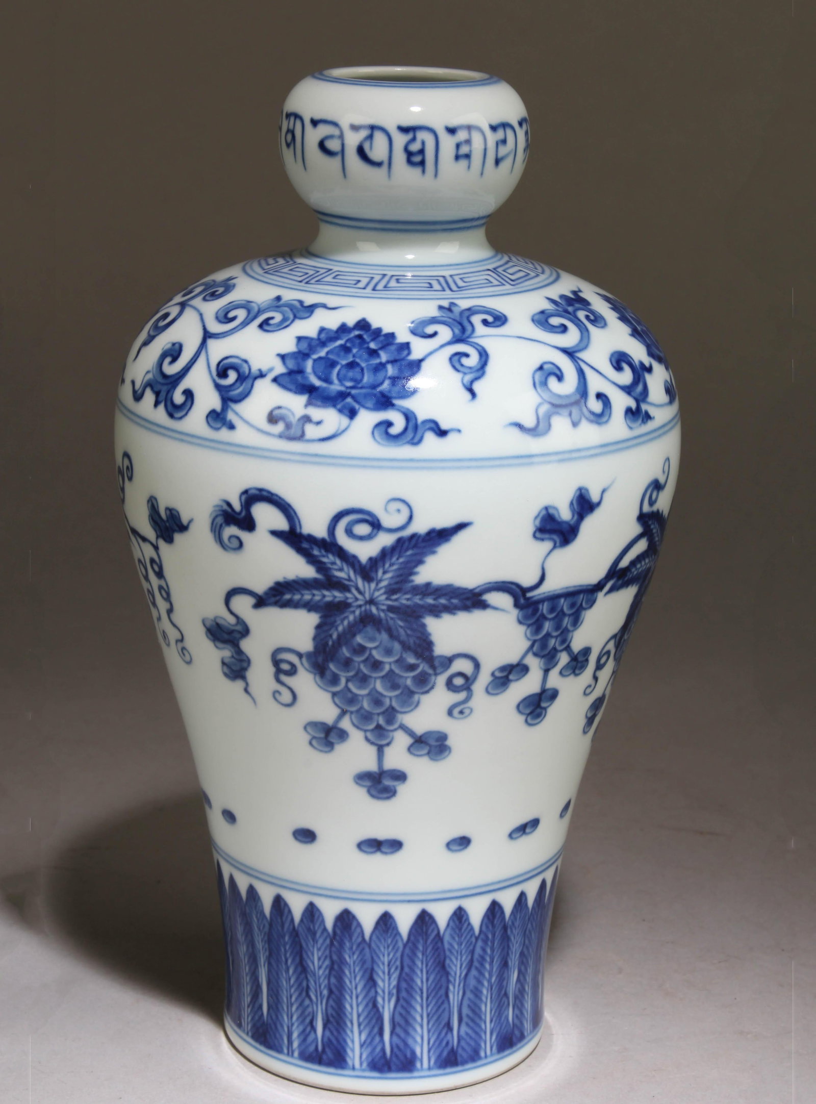 A Blue and White Chinese Vase with a Floral Design: A Blue and White Chinese Vase with a Floral Design. Dimension: 8.25" x 4.9".