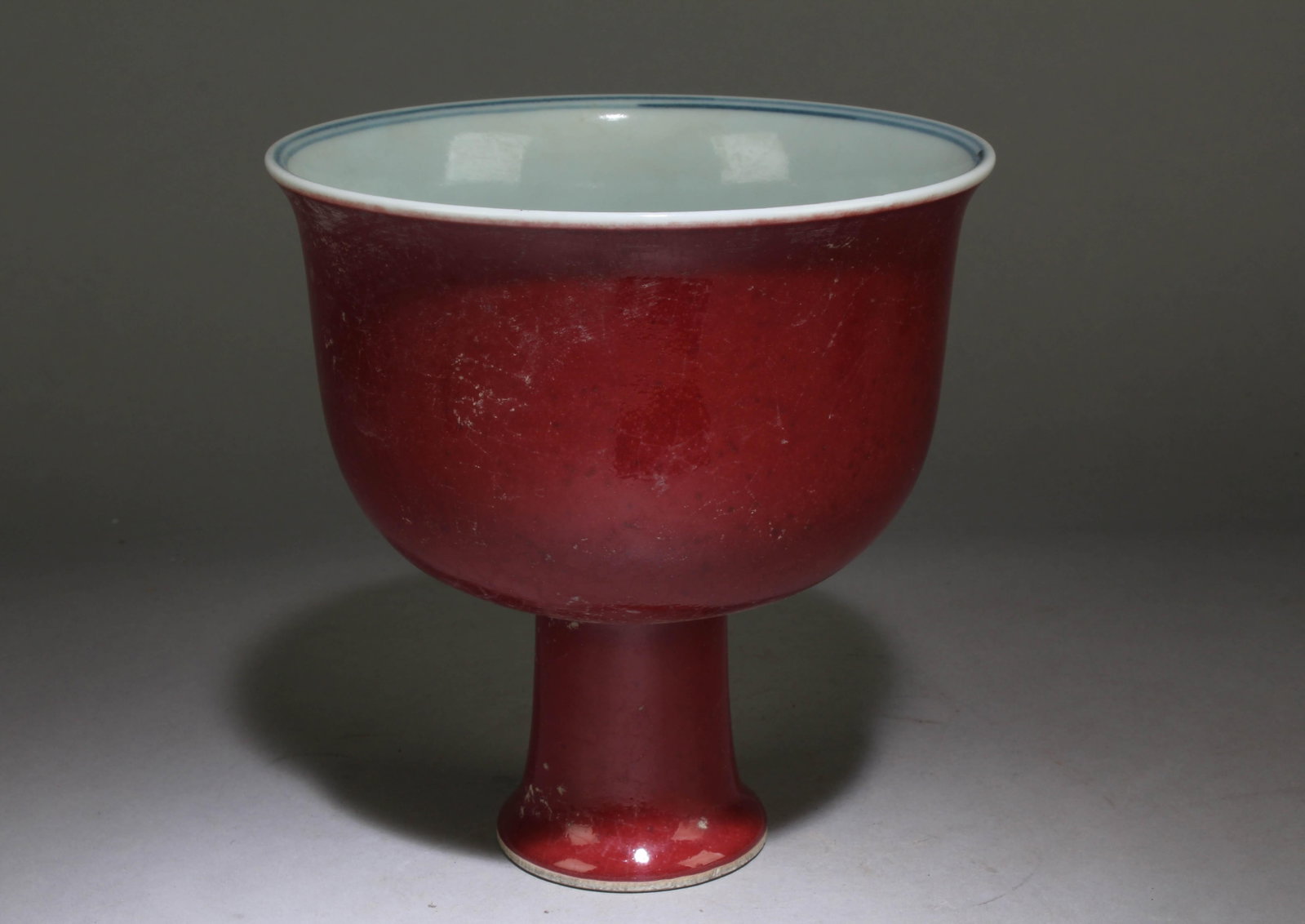 A Chinese Ox-Blood Red Pedestal Bowl: A Chinese Ox-Blood Red Pedestal Bowl. Dimension: 7.1" x 7".