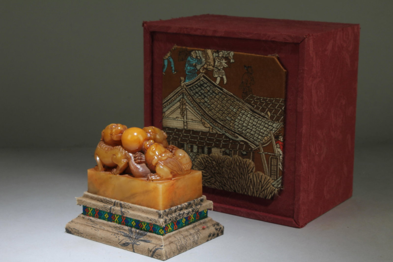 A Chinese Lion Shaped Soapstone Seal: A Chinese Lion Shaped Soapstone Seal. Dimension: 2.75" x 3.4" x 2.3" Dimension with Stand: 4" x 4.5" x 3.4".