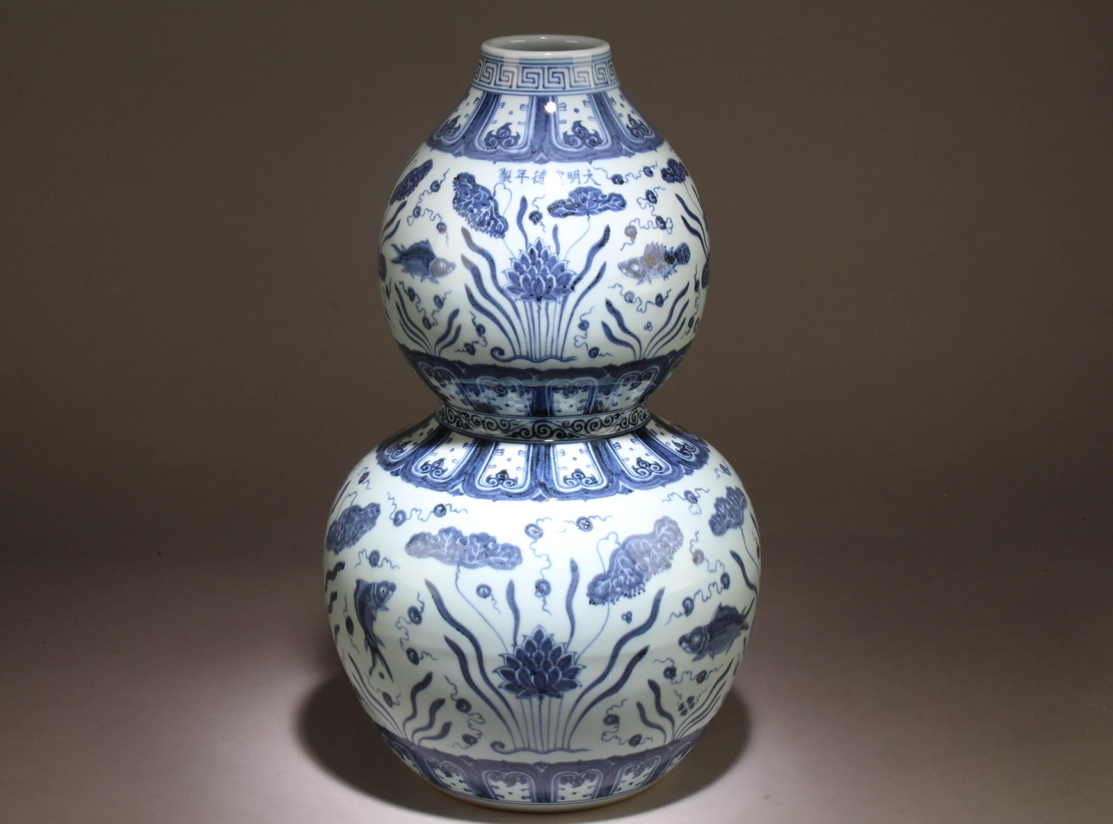 A Chinese Blue and White Gourd Vase: A Chinese Blue and White Gourd Vase. Dimension: 19.5" x 11"