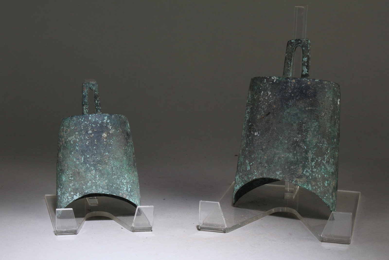 A Set of Two Chinese Bronze Bell: A Set of Two Chinese Bronze Bell. Item 1 Dimension: 7" x 4.2" x 2.6", Item 2 Dimension: 5.2" x 3.2" x 2.2".