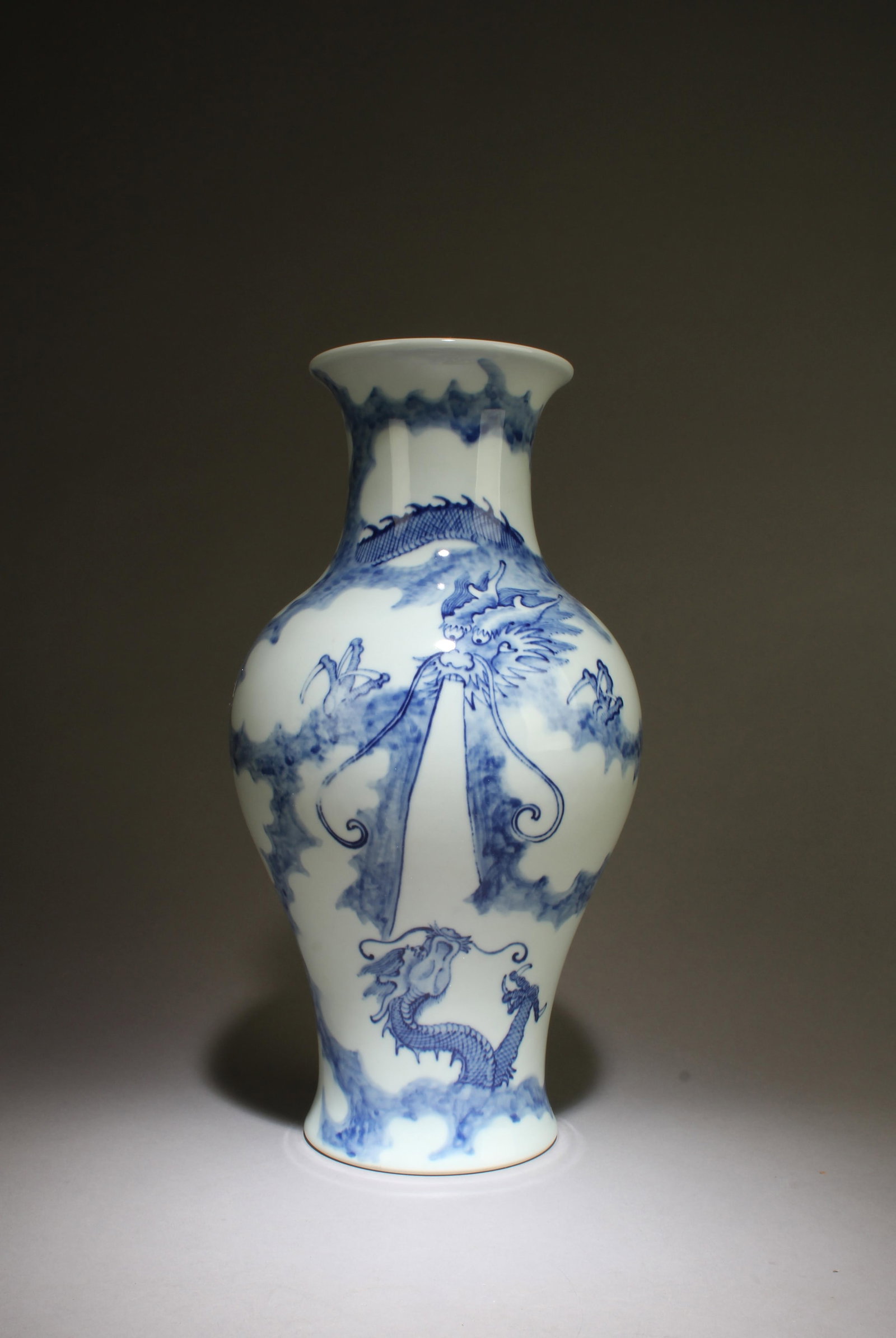 A Blue and White Vase with Dragon Motif: A Blue and White Vase with Dragon Motif.Dimensions: 13.5" x 7.5"