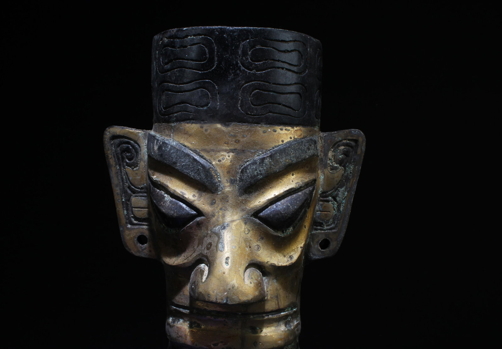 A SanXingDui Gilt Bronze Head Statue: A SanXingDui Gilt Bronze Head Statue. Dimensions: 11.2" x 17".
