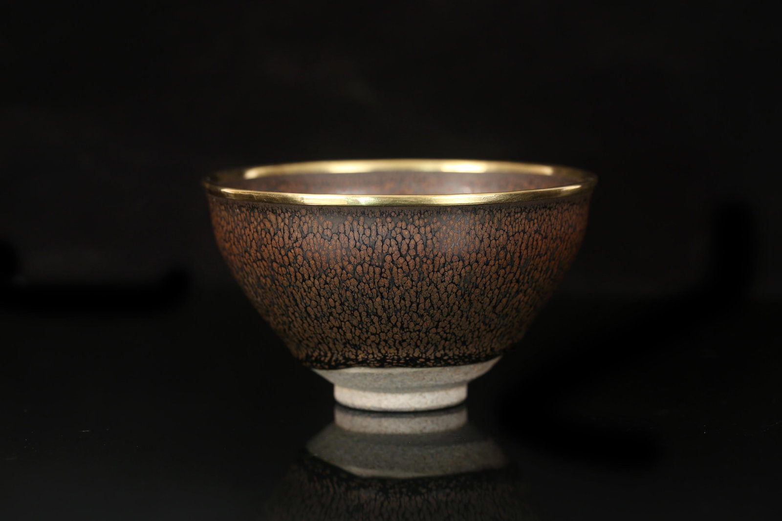 A JianYao Bowl: A JianYao Bowl, the mouth rim with gilt bronze lining. Height: 2.9" Diameter: 5"