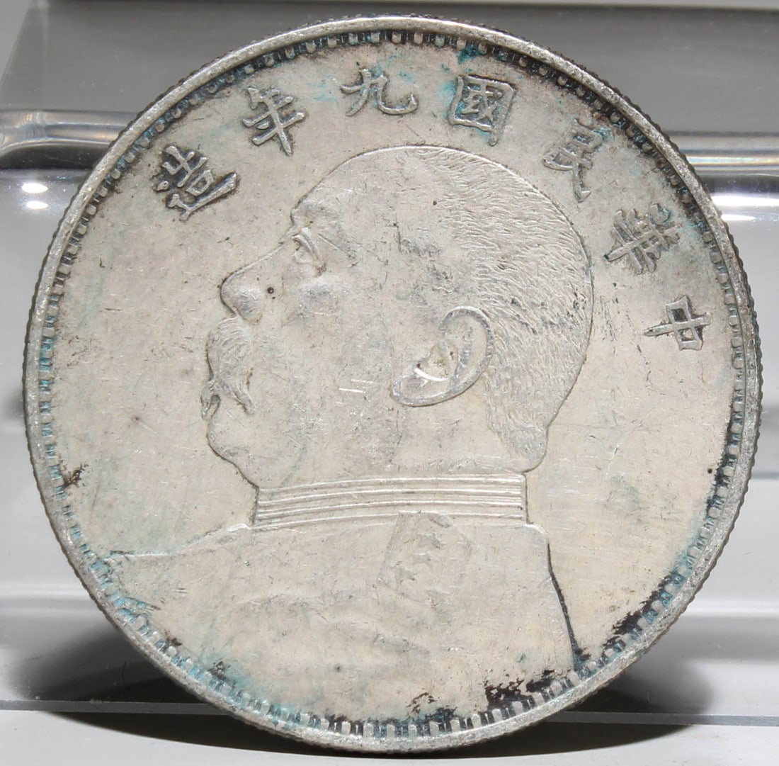 A Silver Coin: A Silver Coin. Diameter: 1.5". Weight: g