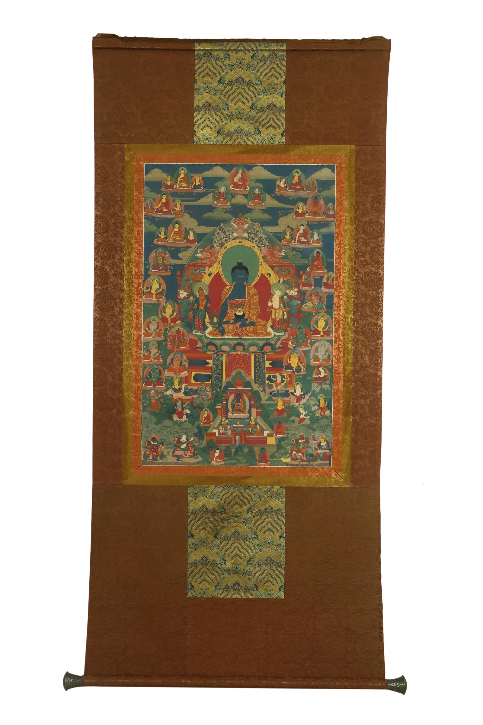 A TIBETAN THANGKA ON SILK FRAME: A TIBETAN THANGKA ON SILK FRAME.30.31" x 65.75" (with frame); 19.69" x 31.5" (without frame)
