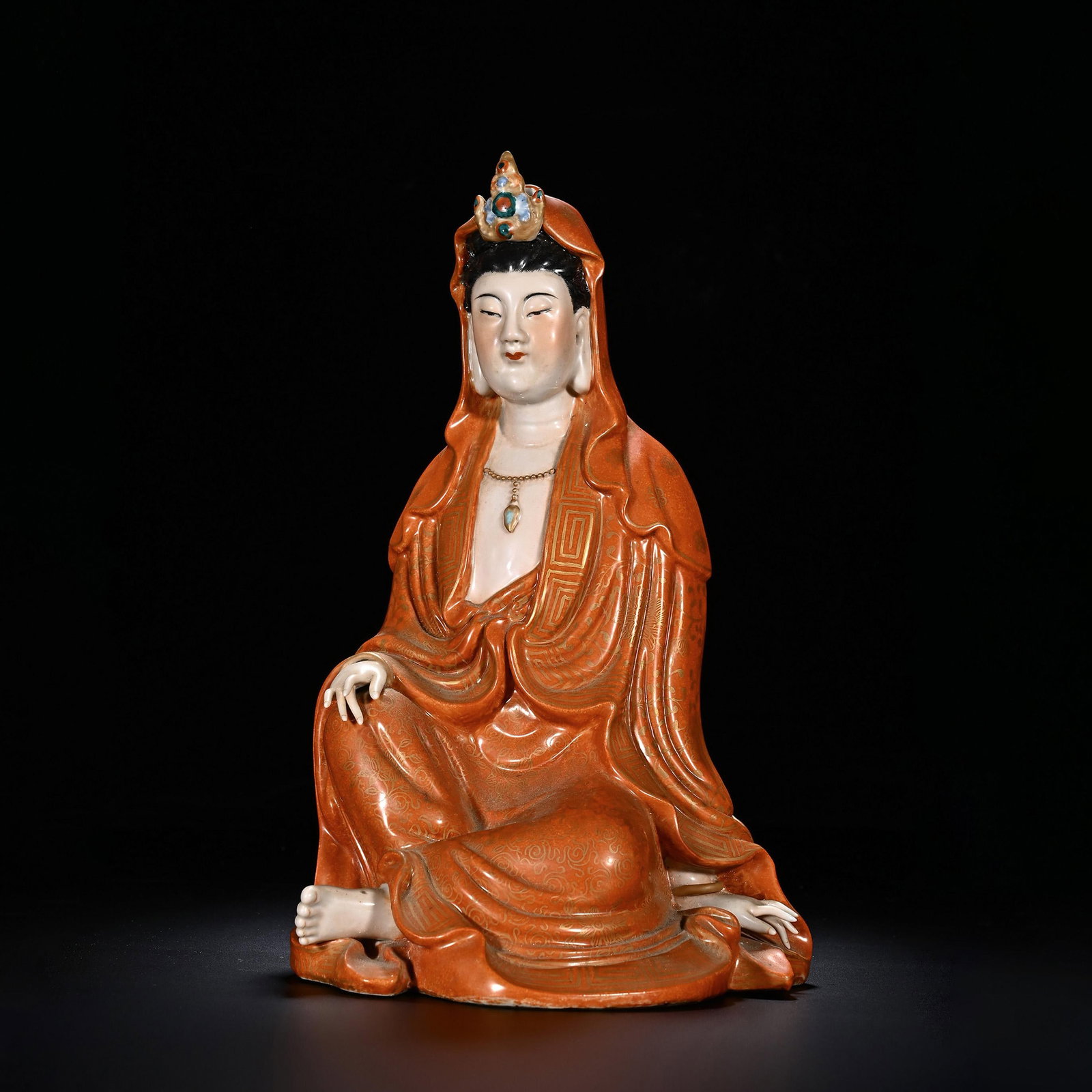 Coral-Ground Guanyin Seated Figure: Coral-Ground Guanyin Seated Figure. Length:6.89" Width:5.31" Height:11.02"