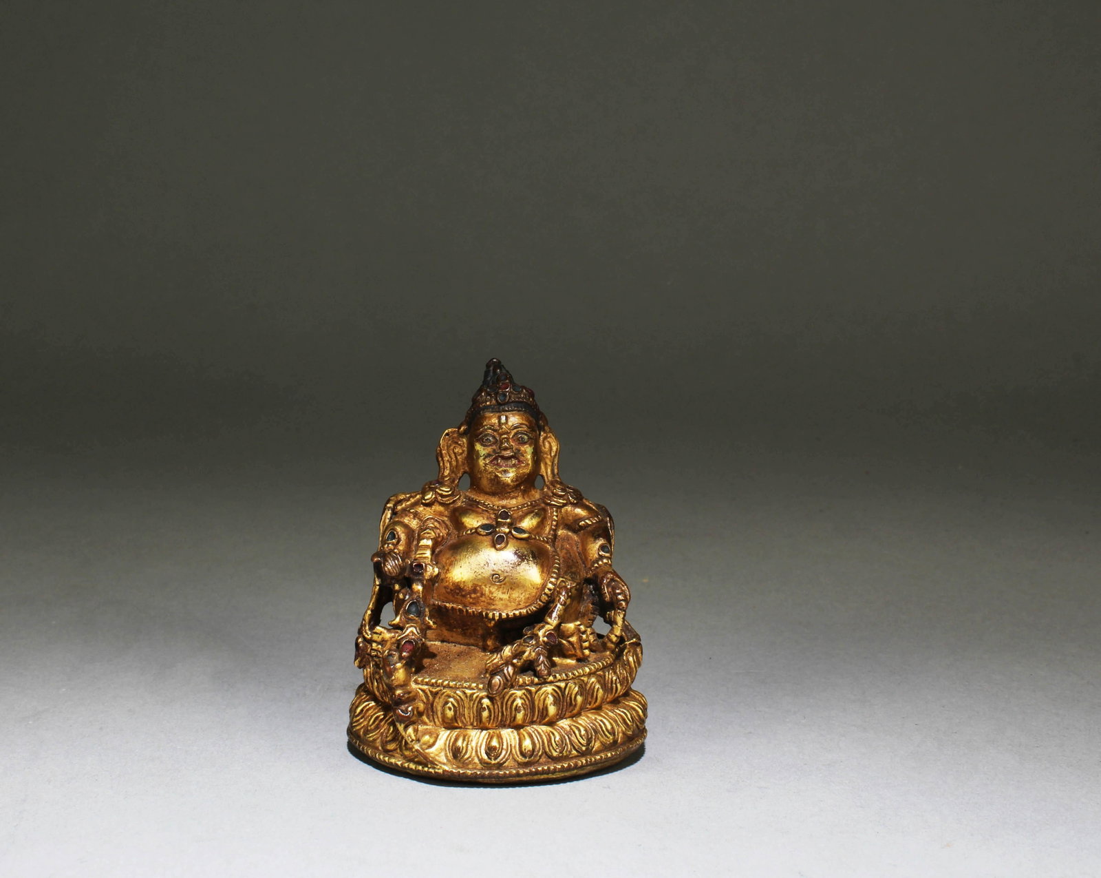 A Gilt Bronze Statue: A Gilt Bronze Statue. Dimensions: 3" x 2"