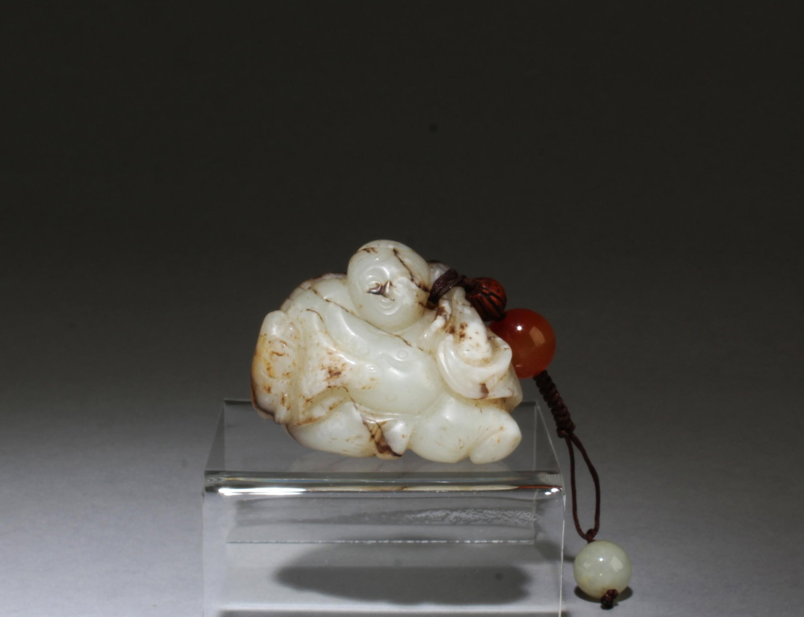 A Carved Jade Ornament: A Carved Jade Ornament. Length: 2.25"