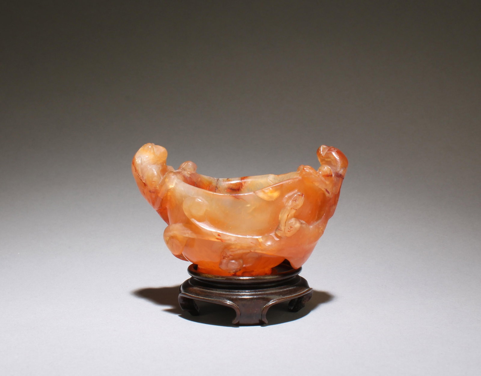 Antique Nanhong Agate Vessel Ornament, MING: Ming Dynasty, Antique Nanhong Agate Vessel Ornament. Comes with a wooden base. Dimension: 3" x 1.7"Provenance: Pasadena Antique Center