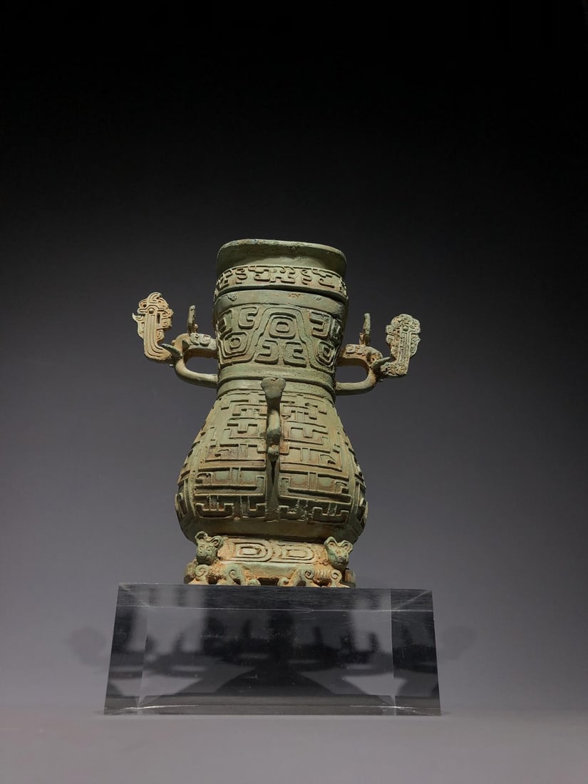 A Bronze Double-Dragon Vessel: A Bronze Double-Dragon Vessel. Dimensions: 7.87in x 4.72in x 9.45in Weight: 8.82lbs.