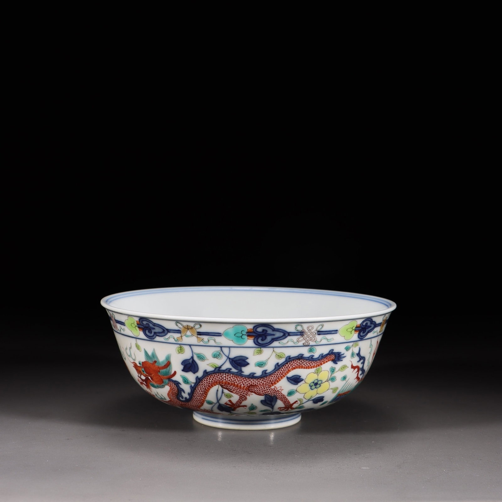 A Doucai Dragon-and-Phoenix Bowl: A Doucai Dragon-and-Phoenix Bowl. Height: 2.36in Diameter: 5.98in Weight: 0.54lbs.