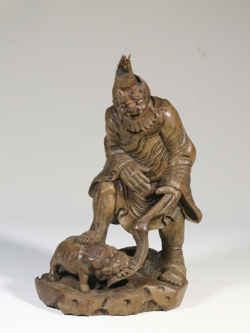 A Bamboo Carved Foreign-Figure Lion-Play Statue: A Bamboo Carved Foreign-Figure Lion-Play Statue. Dimensions: 7.09in x 5.04in x 3.54in Weight: 0.65lbs.